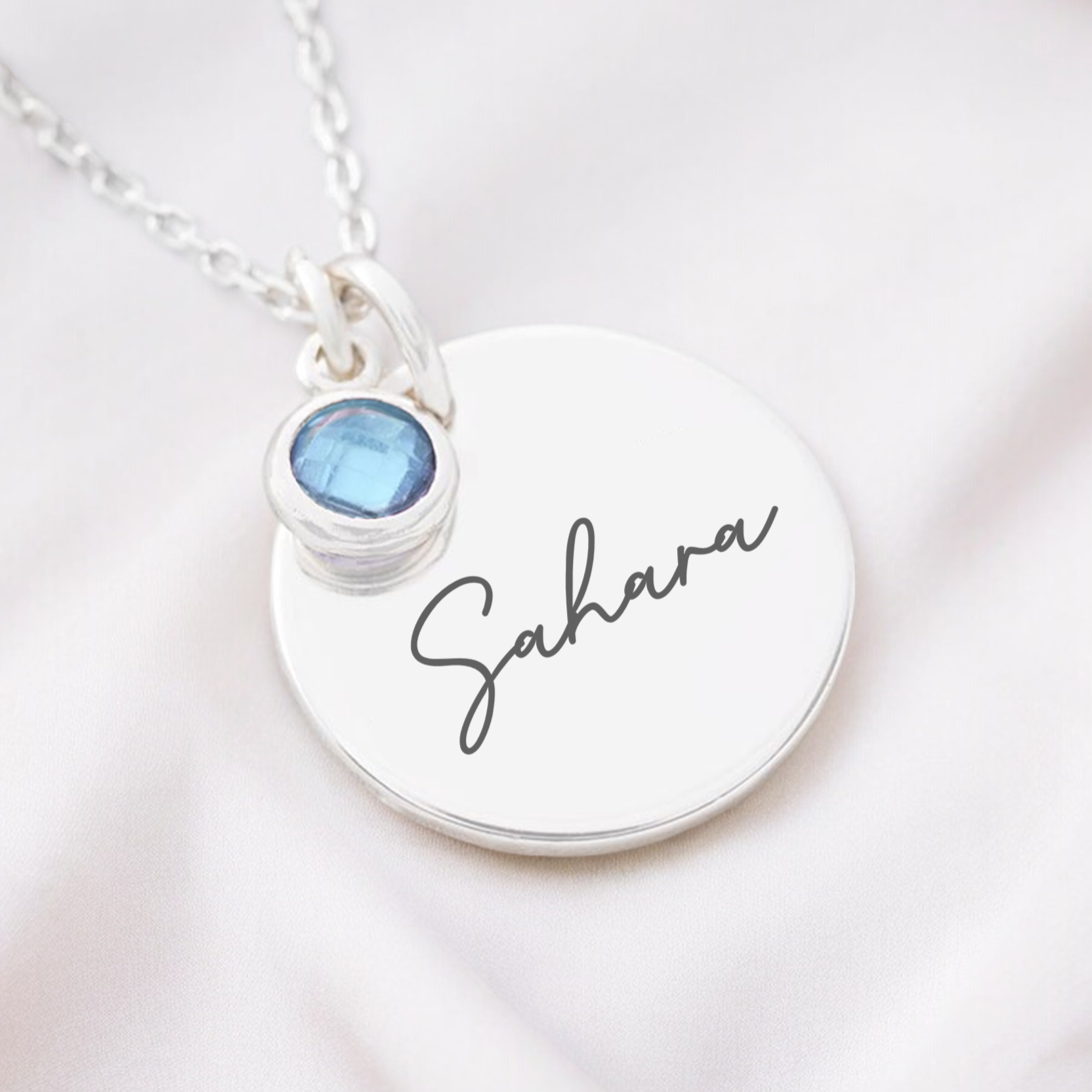 Personalised name necklace with birthstone charm on silver pendant