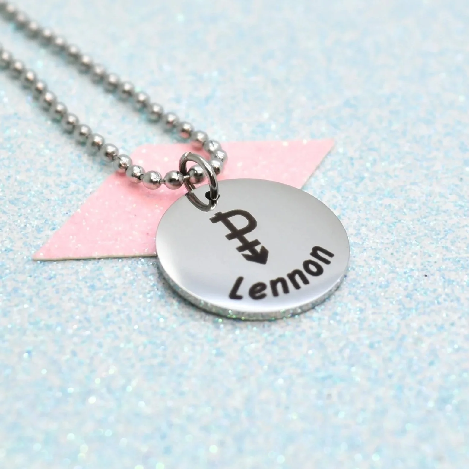 Round pendant necklace featuring pansexual pride symbol and ball chain