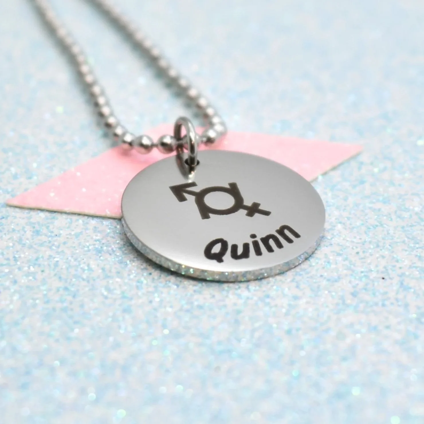Personalised genderfluid pride jewellery featuring engraved pride symbol