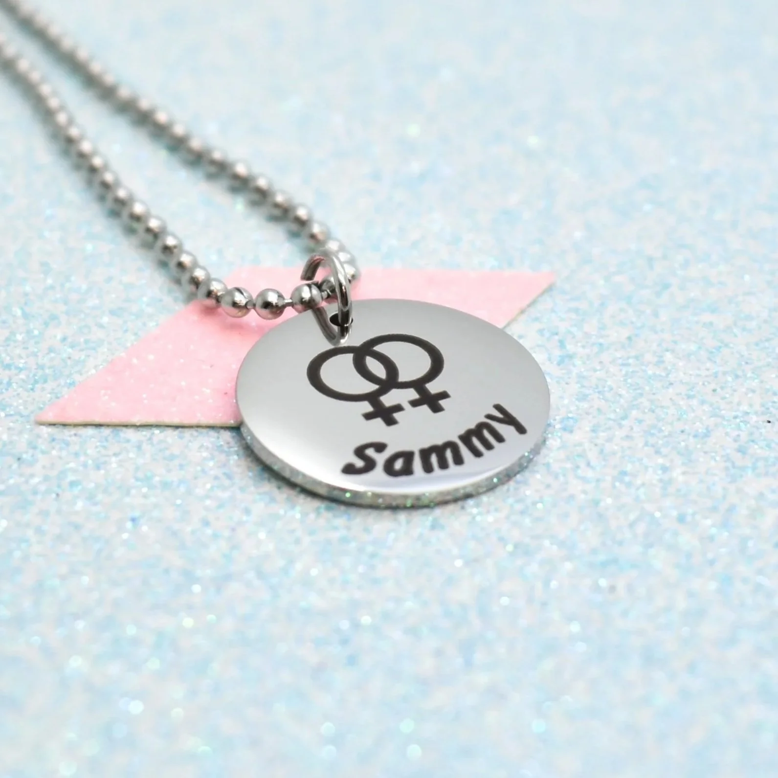 Personalised lesbian pride jewellery featuring double Venus symbol