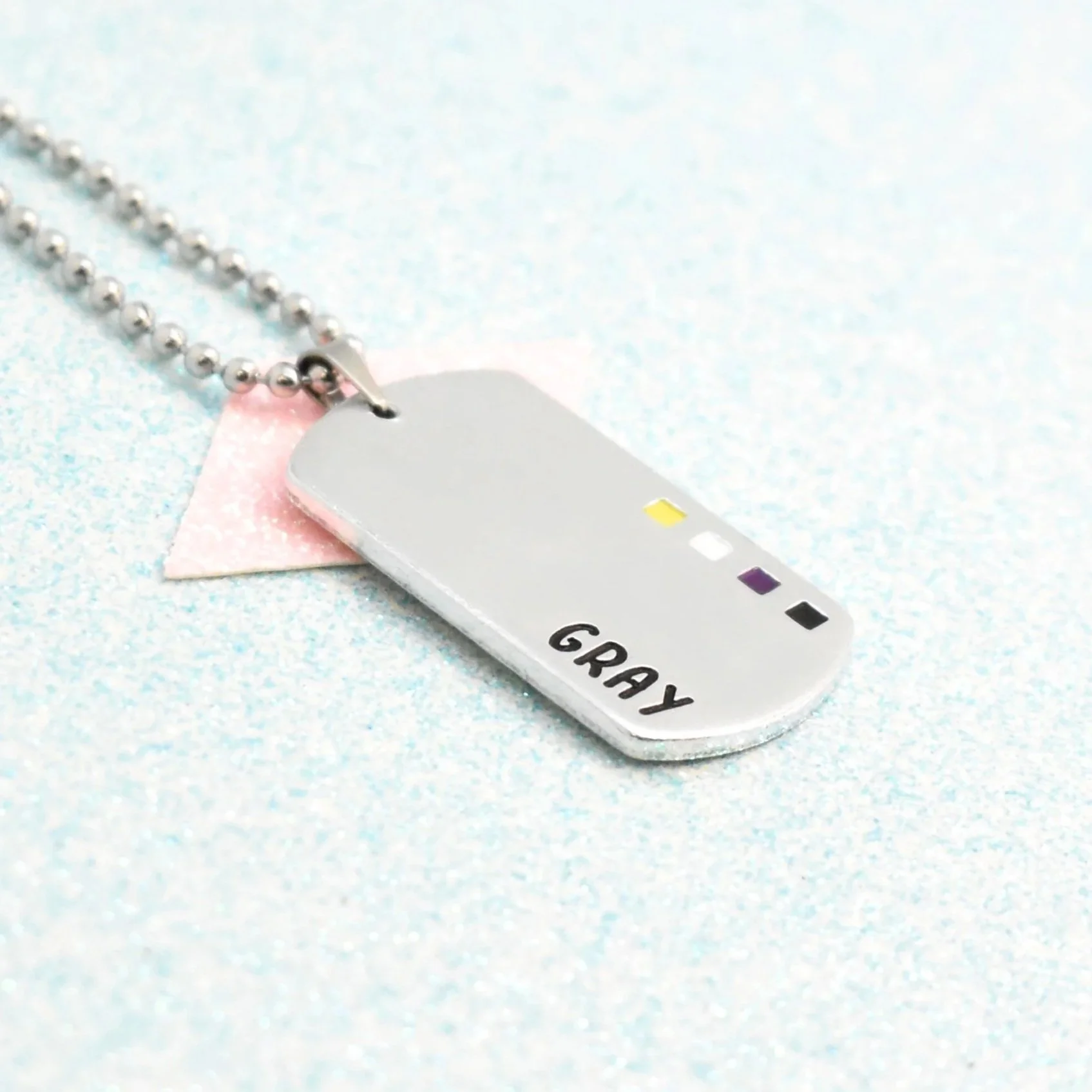 Custom nonbinary flag jewellery with enamel accents