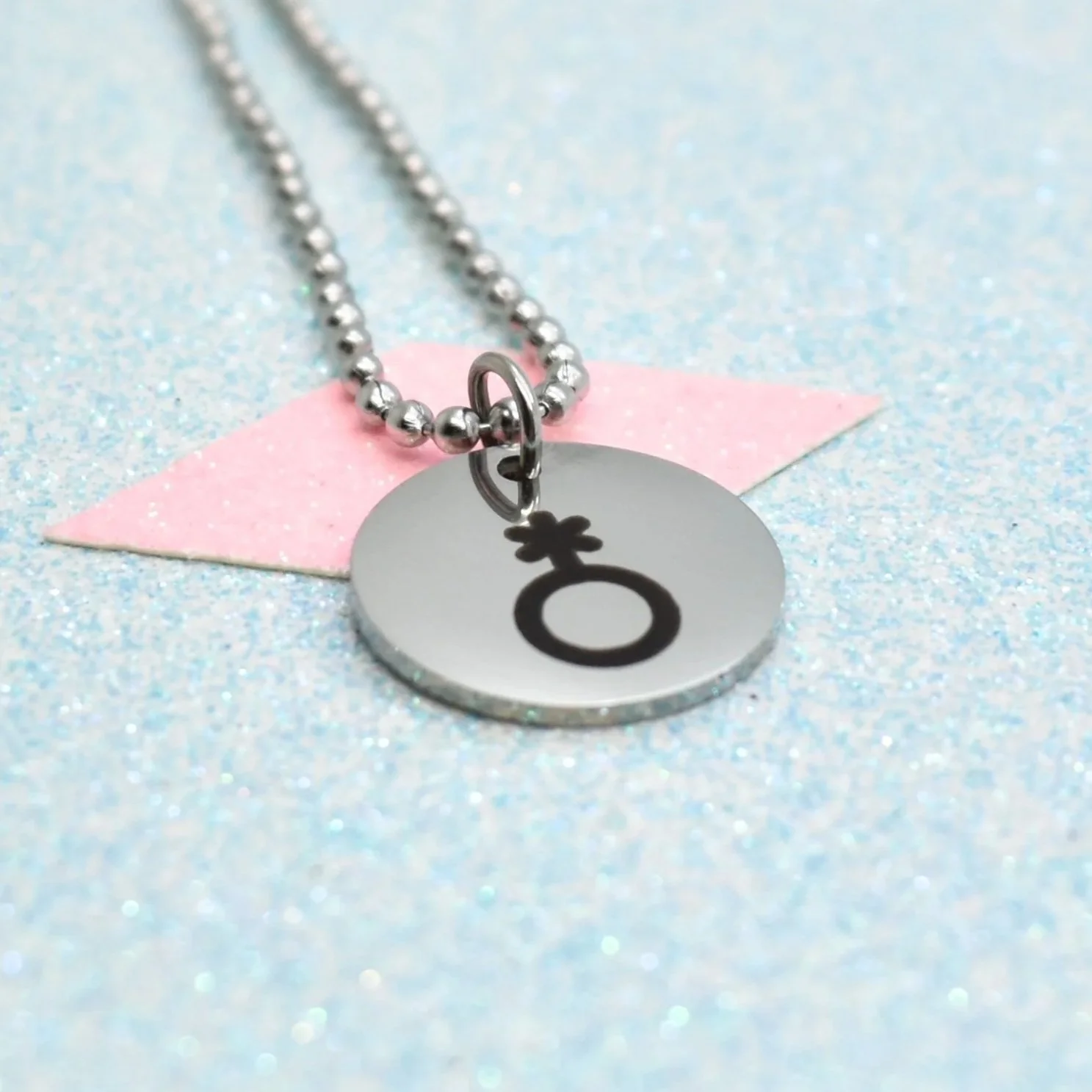 Stainless steel pendant necklace featuring non-binary gender symbol