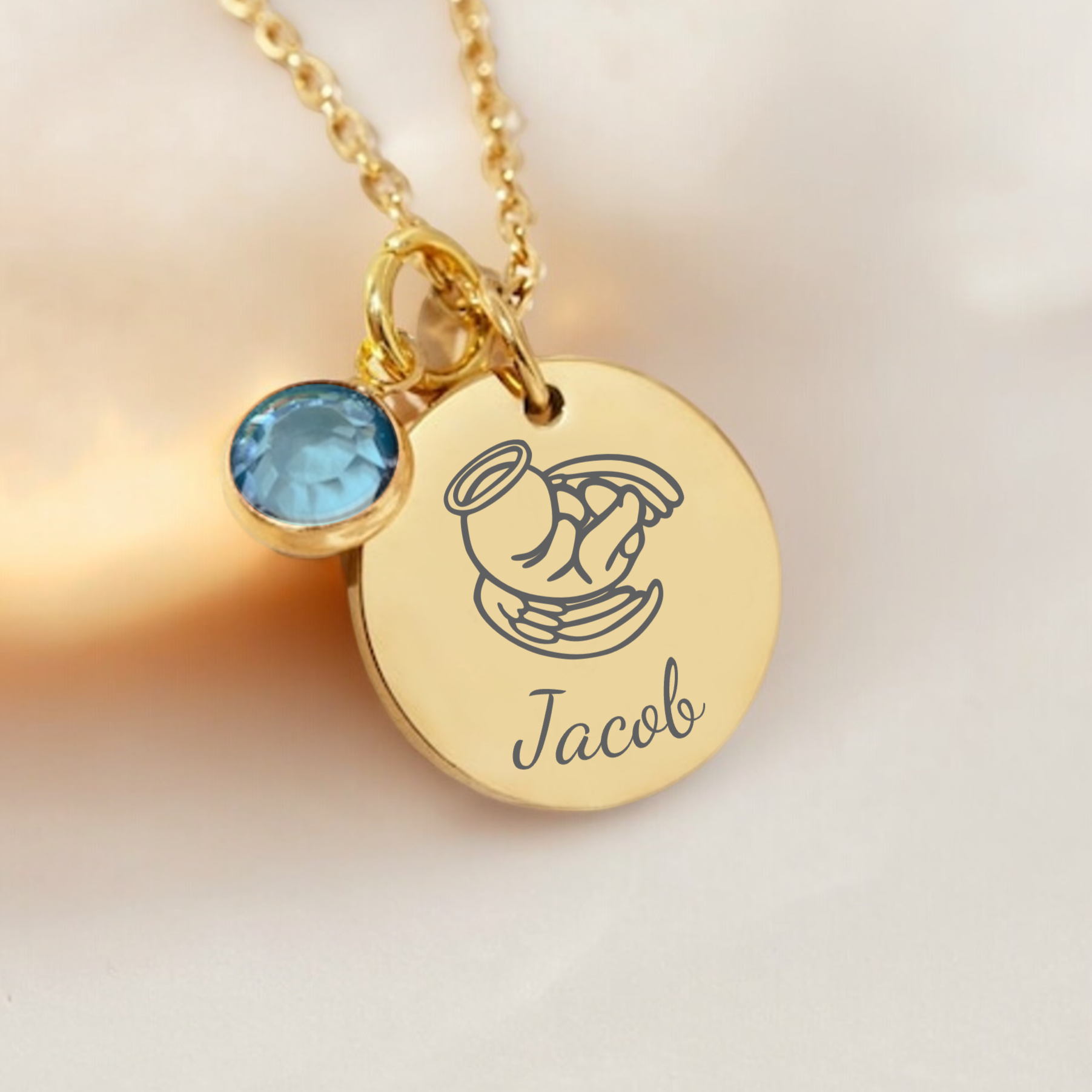 A Gold Baby Loss Memorial Necklace with a personalised name and birthstone