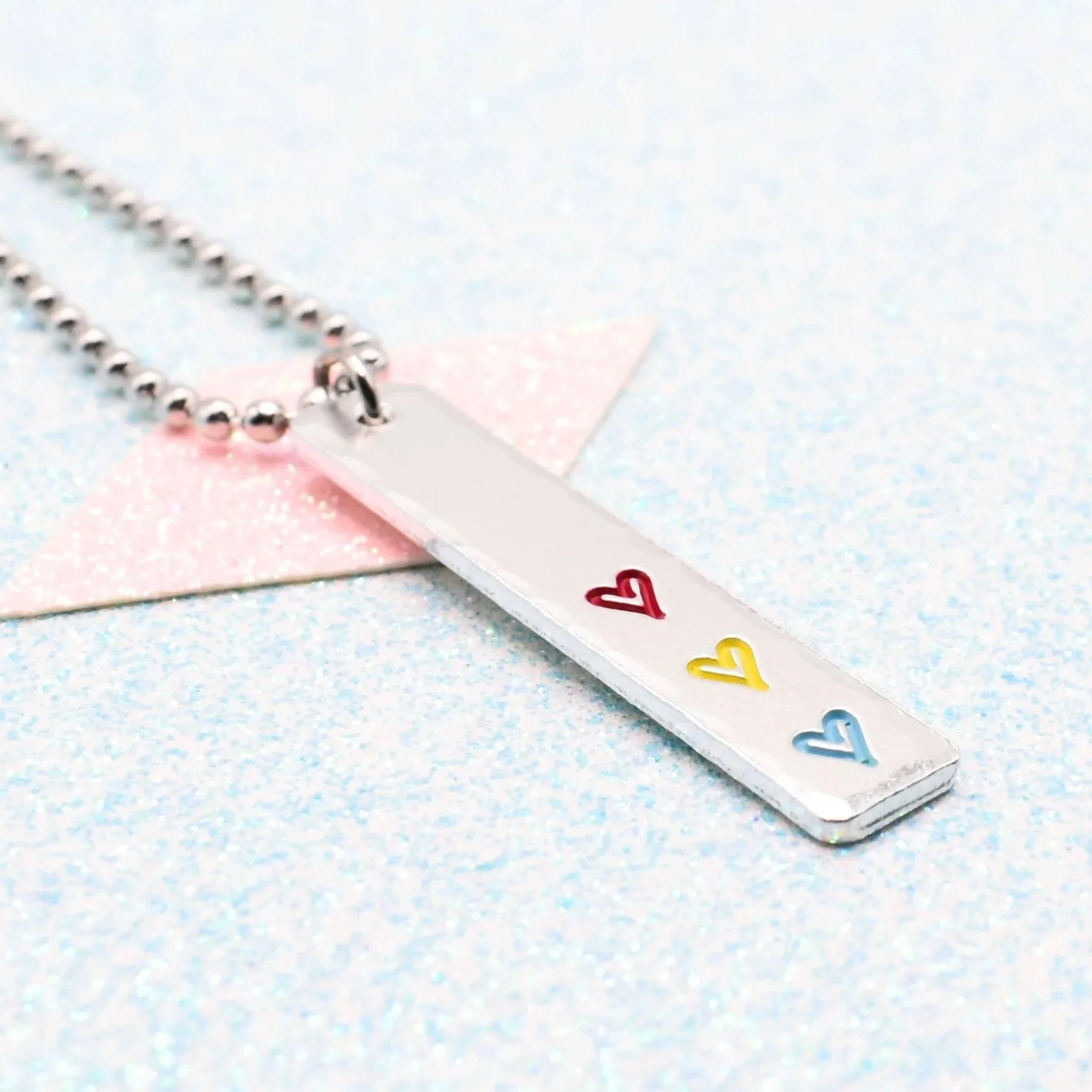 Hand stamped enamelled pansexual pride necklace with heart pendant
