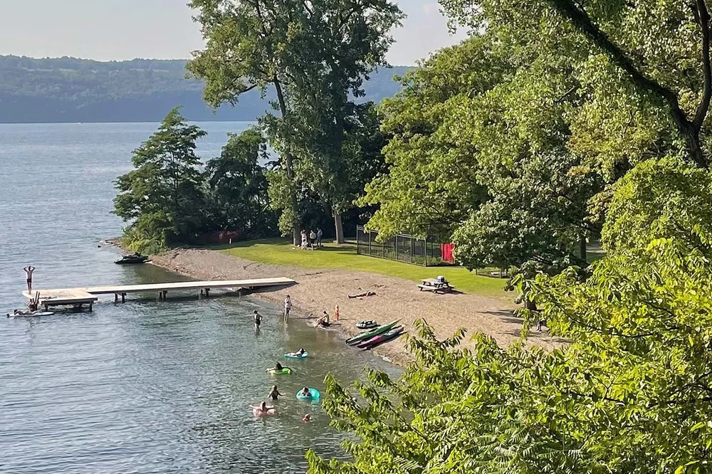 Swimmers and sunbathers at the Smith Memorial Park beach on Seneca Lake
