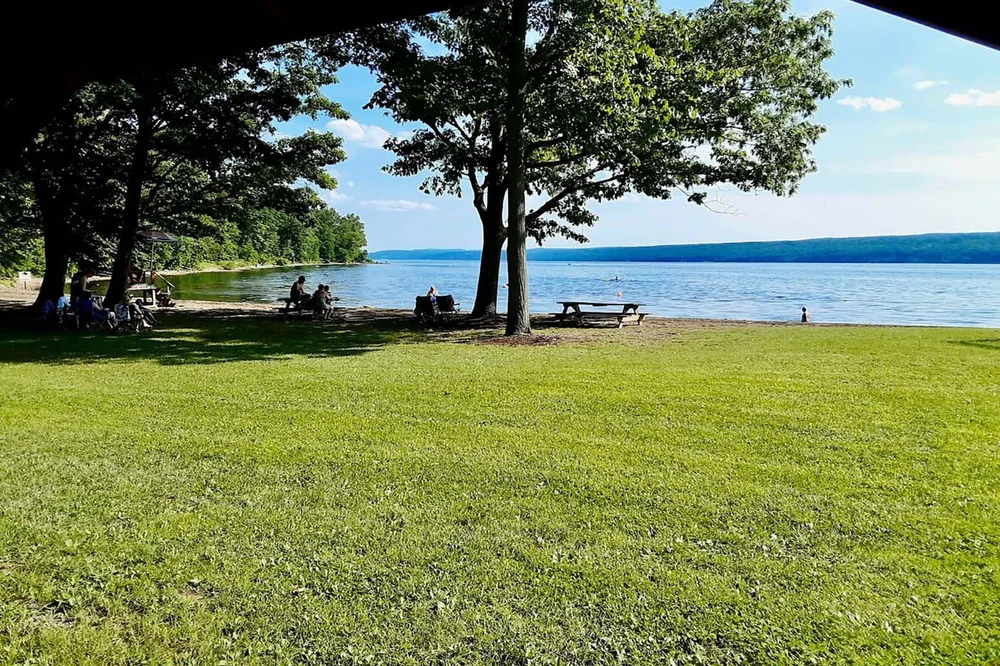 The grassy lakeside Green at Smith Memorial Park