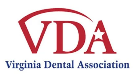 Virginia Dental Association logo with red and blue text and design.