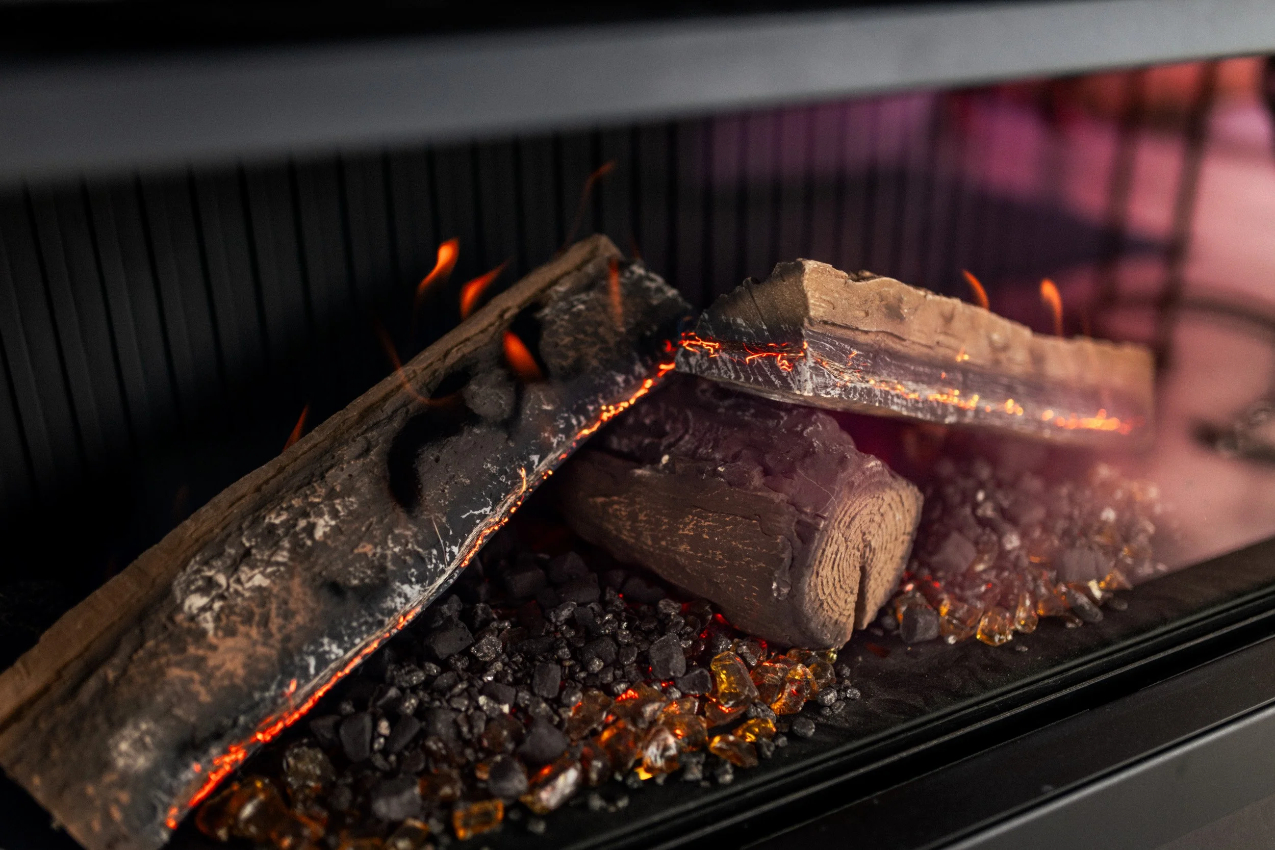 Close-up of beautiful gas fireplace at Ocean View Te Arai, adding a refined touch to the luxury coastal interior.