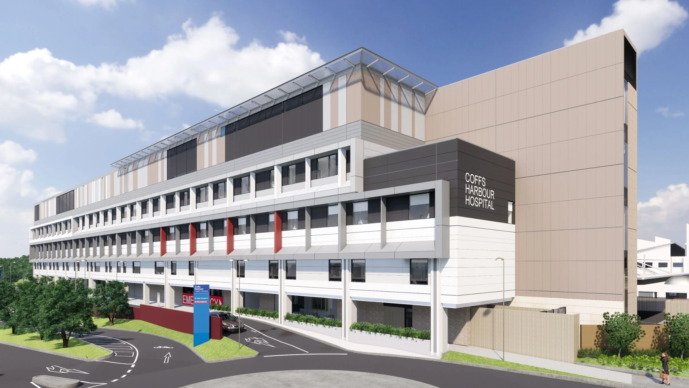 A modern multi-story hospital building with the sign 'COFFS HARBOUR HOSPITAL' on the side, a parking lot with parked cars, a landscaped area with trees, and a person walking on the sidewalk under a partly cloudy sky.