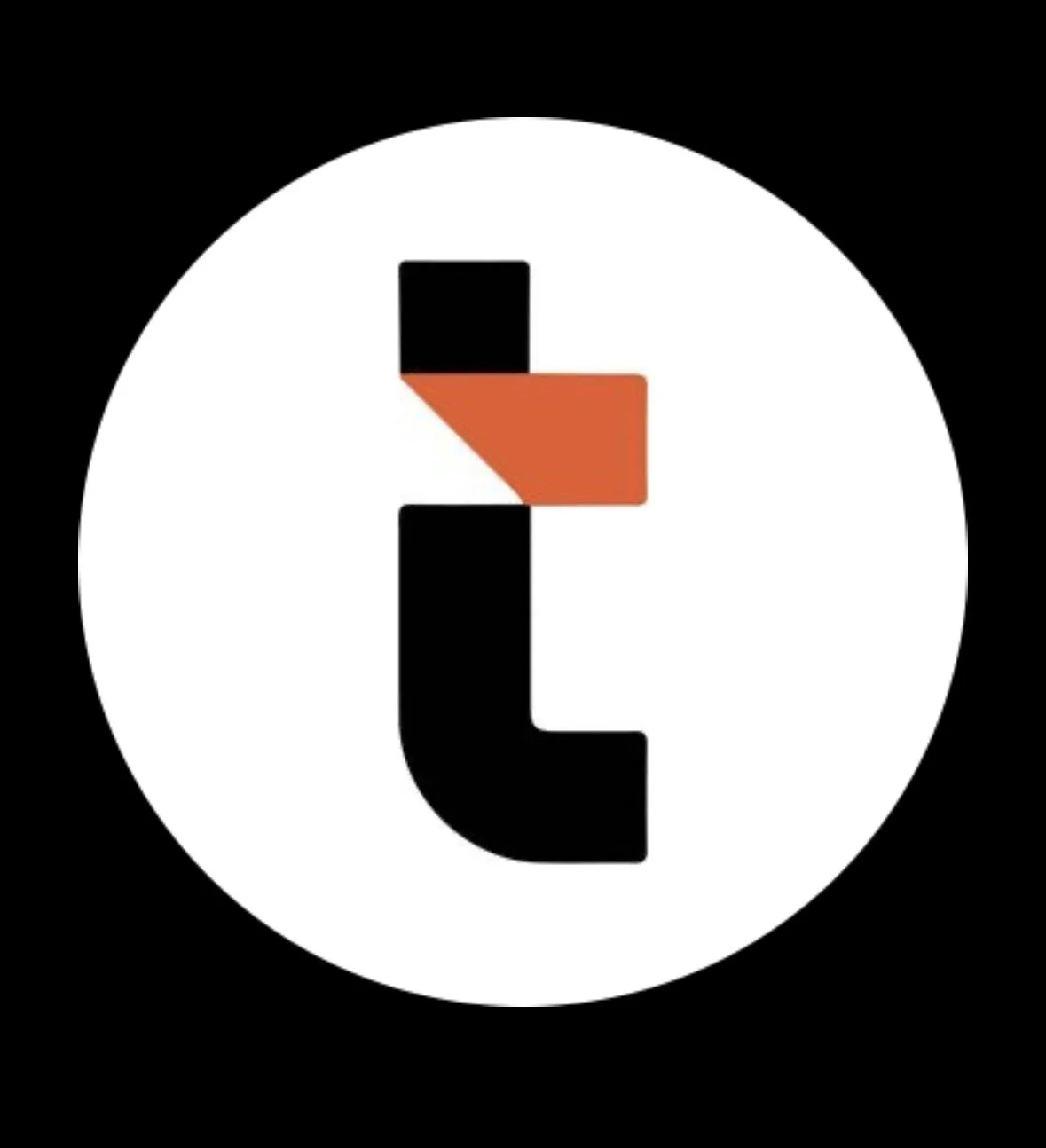 A graphic logo featuring a black lowercase letter 't' inside a white circle with a black background. The top part of the 't' has a red and orange square shape attached, resembling a stylized cross or plus sign.