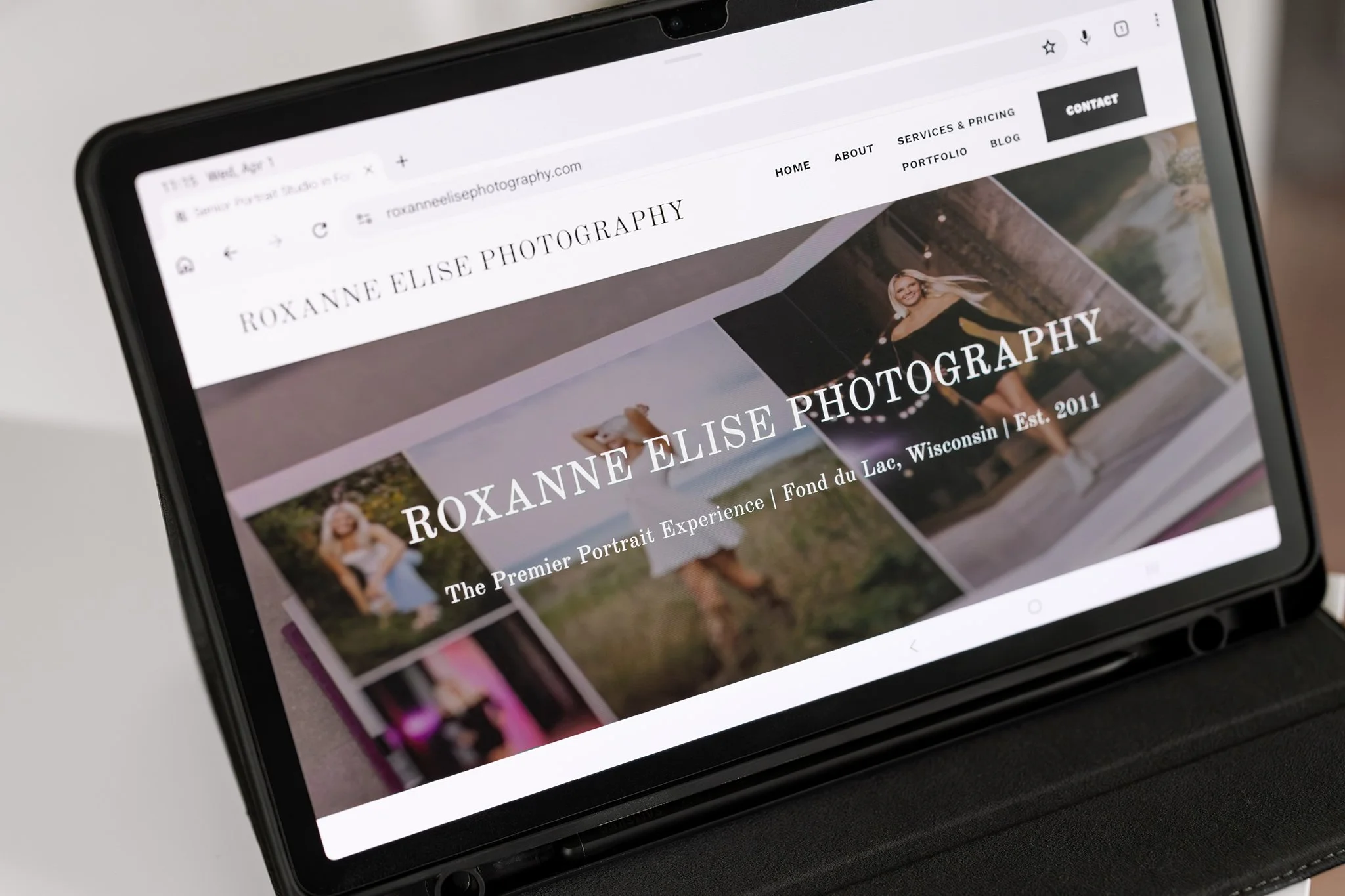 Tablet screen displaying the Roxanne Elise Photography website homepage