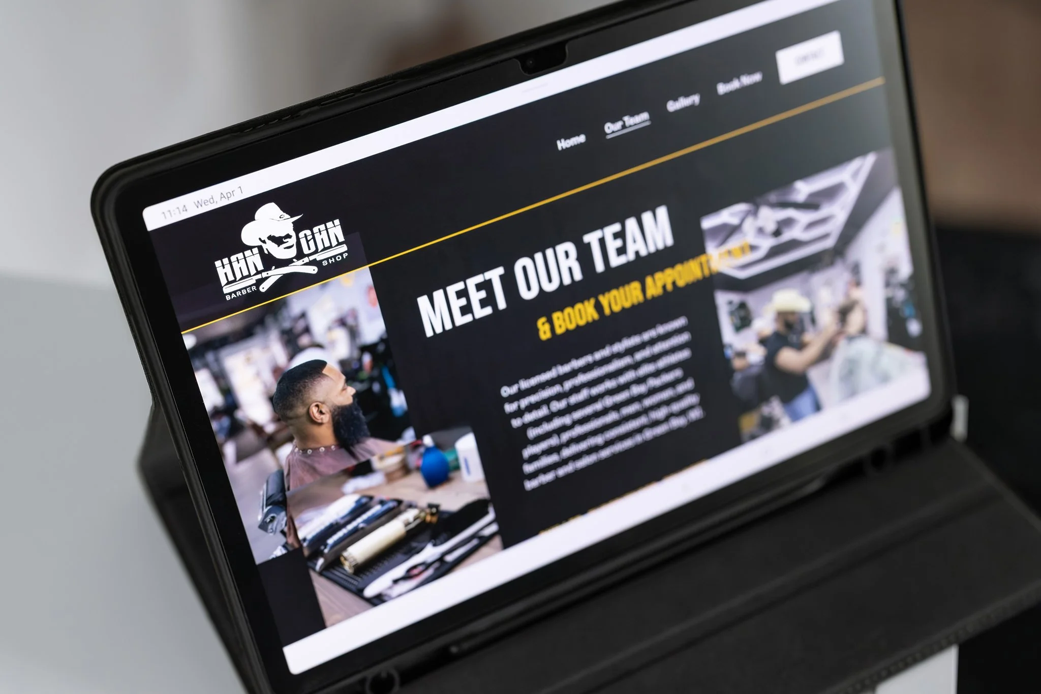 Tablet screen displaying the Team page of Hancan Barbershop's website