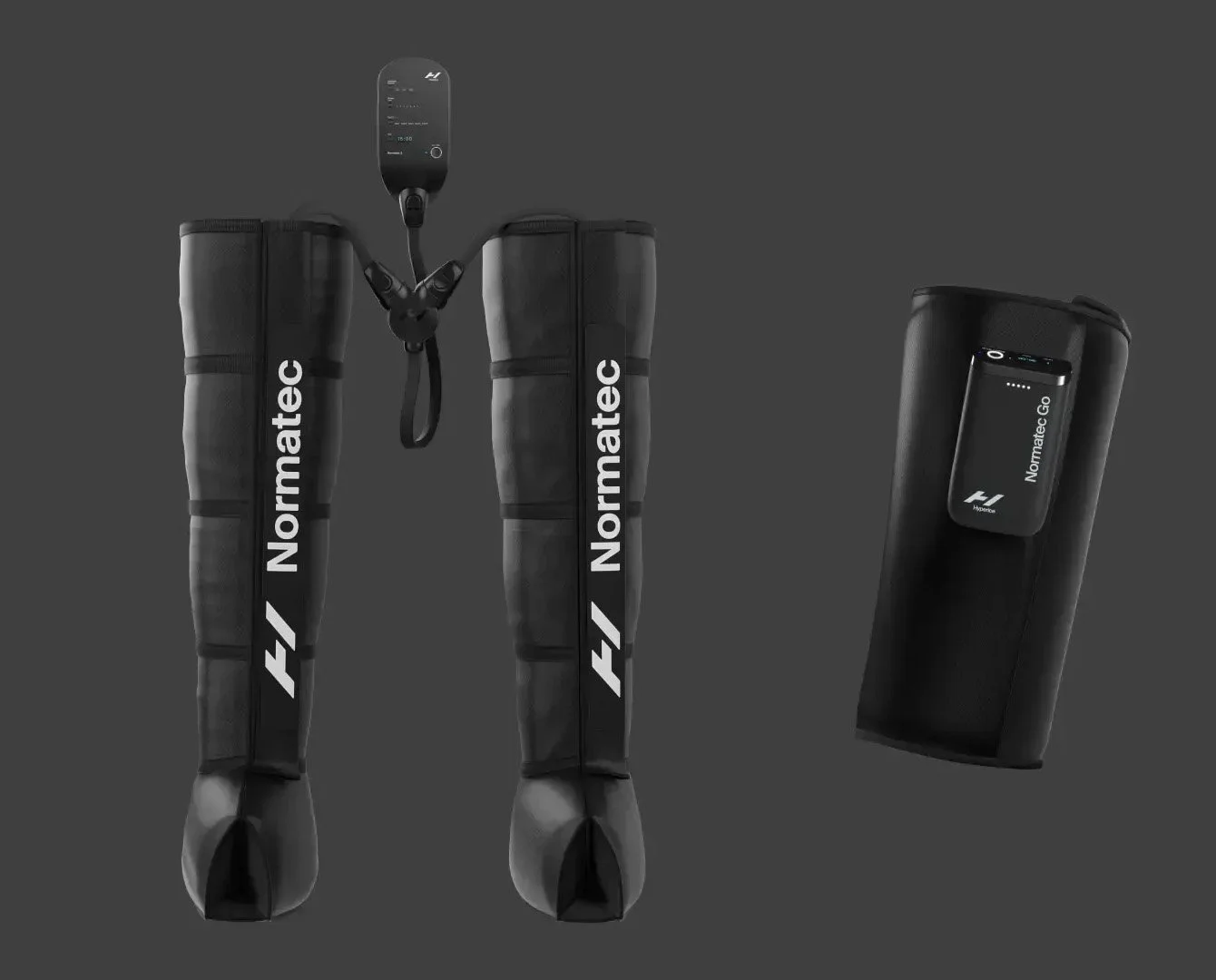 A pair of black compression leg covers labeled 'Normatec' with connected hoses and a control unit, alongside a separate compact device also labeled 'Normatec GO' and a small remote control on a gray background.