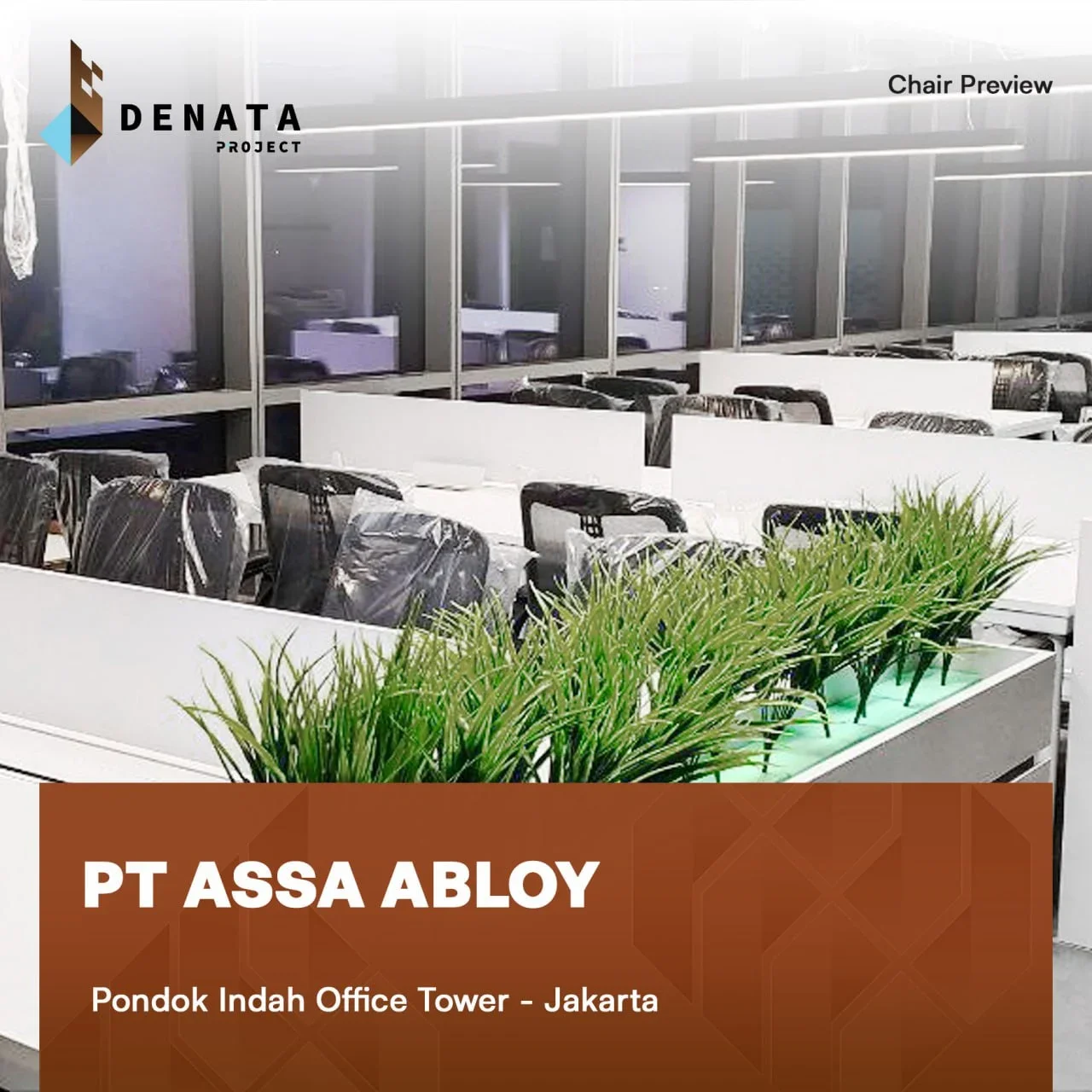 Office interior with white desks, black chairs covered in plastic, and green plants in a modern conference room.