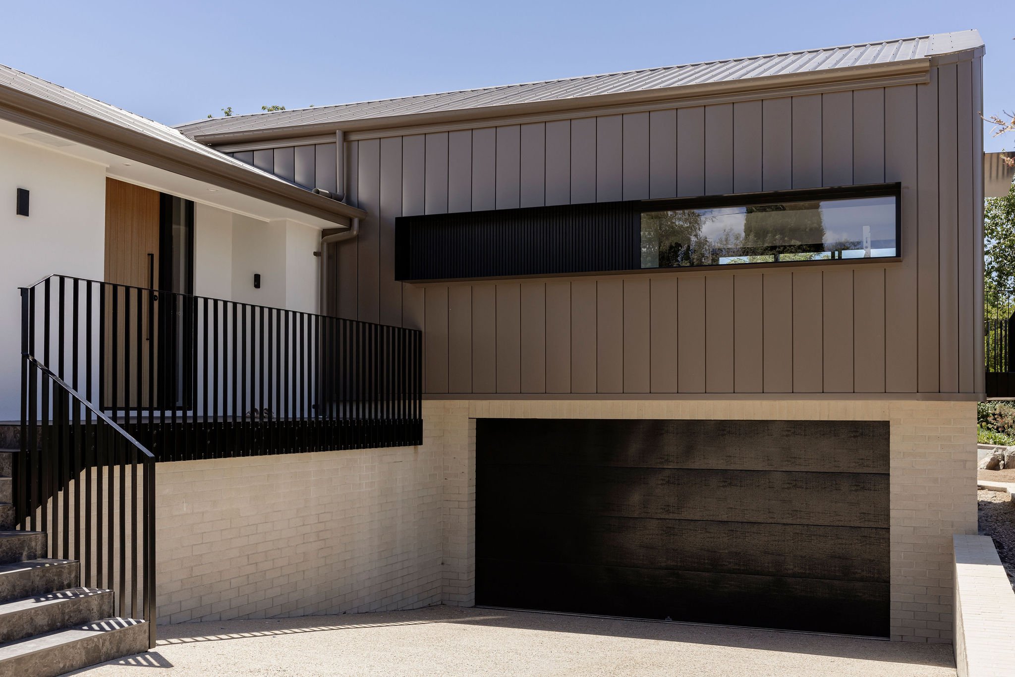 front facade with basement, custom window shroud, custom balustrade, Colourbond Jasper Cladding