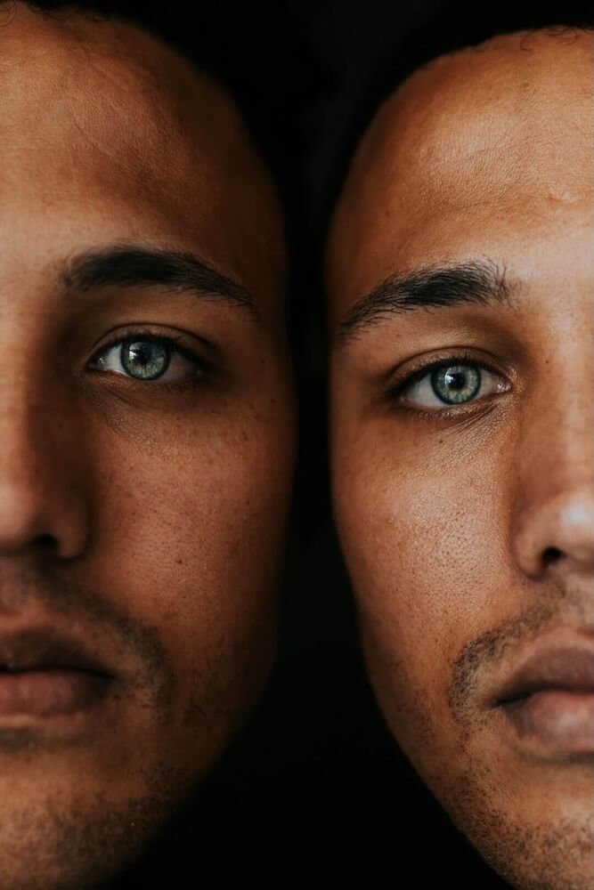 Two close-up portraits of the same person- 2 sides to addiction