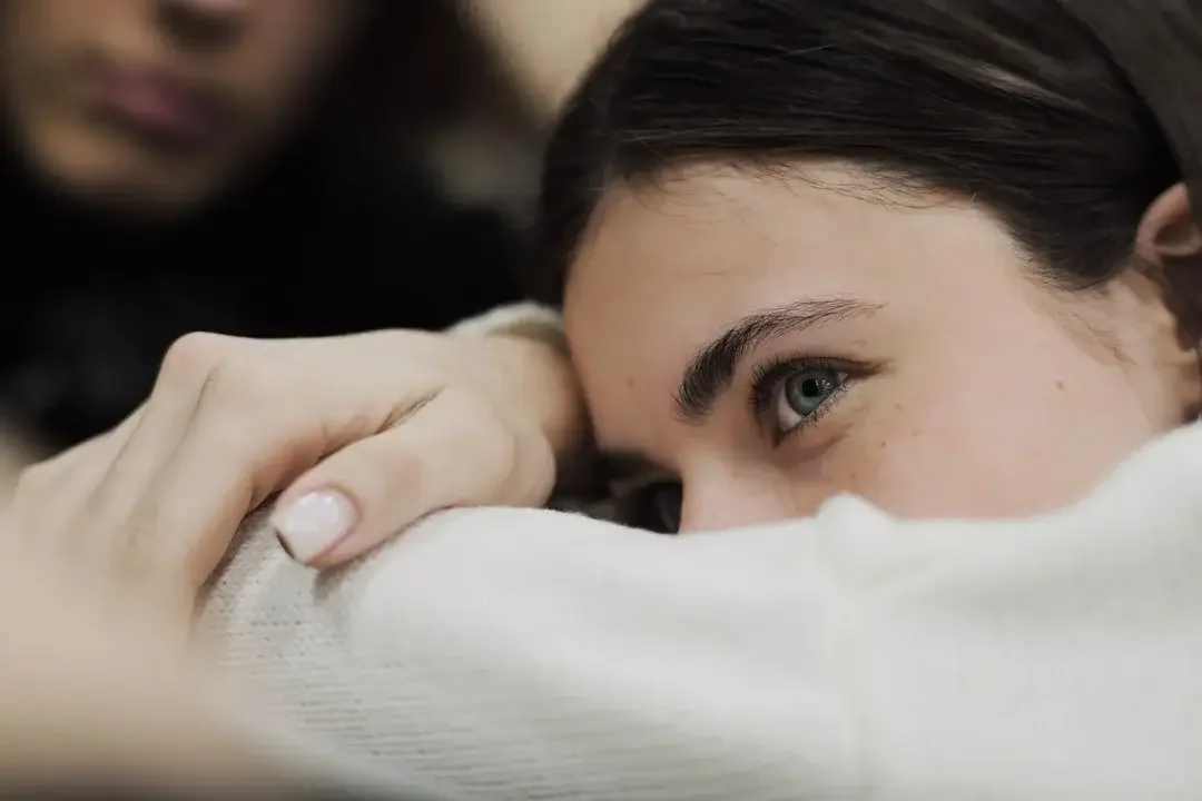 Woman resting comfortably during medication-assisted treatment in Orange County