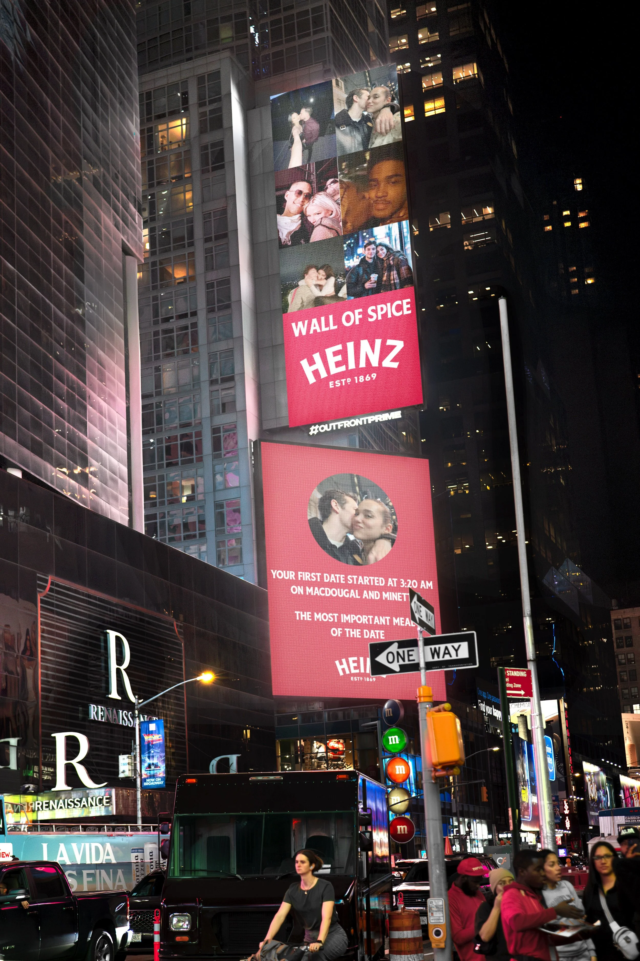 Digital billboards in Times Square, New York City, displaying ads and photos of a couple and Heinz branding, with pedestrians and vehicles below at night.