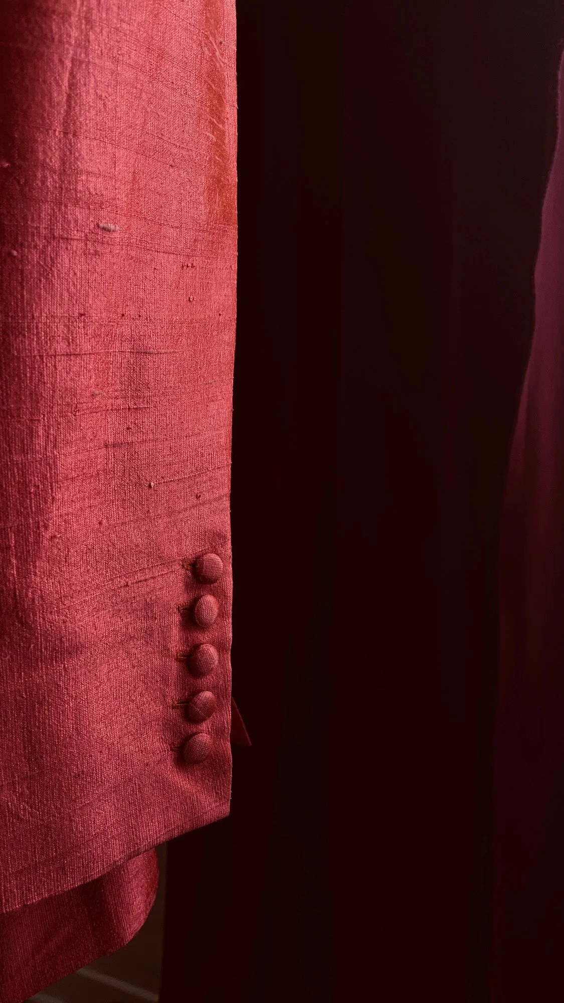 Custom shantung silk suit with covered buttons details.