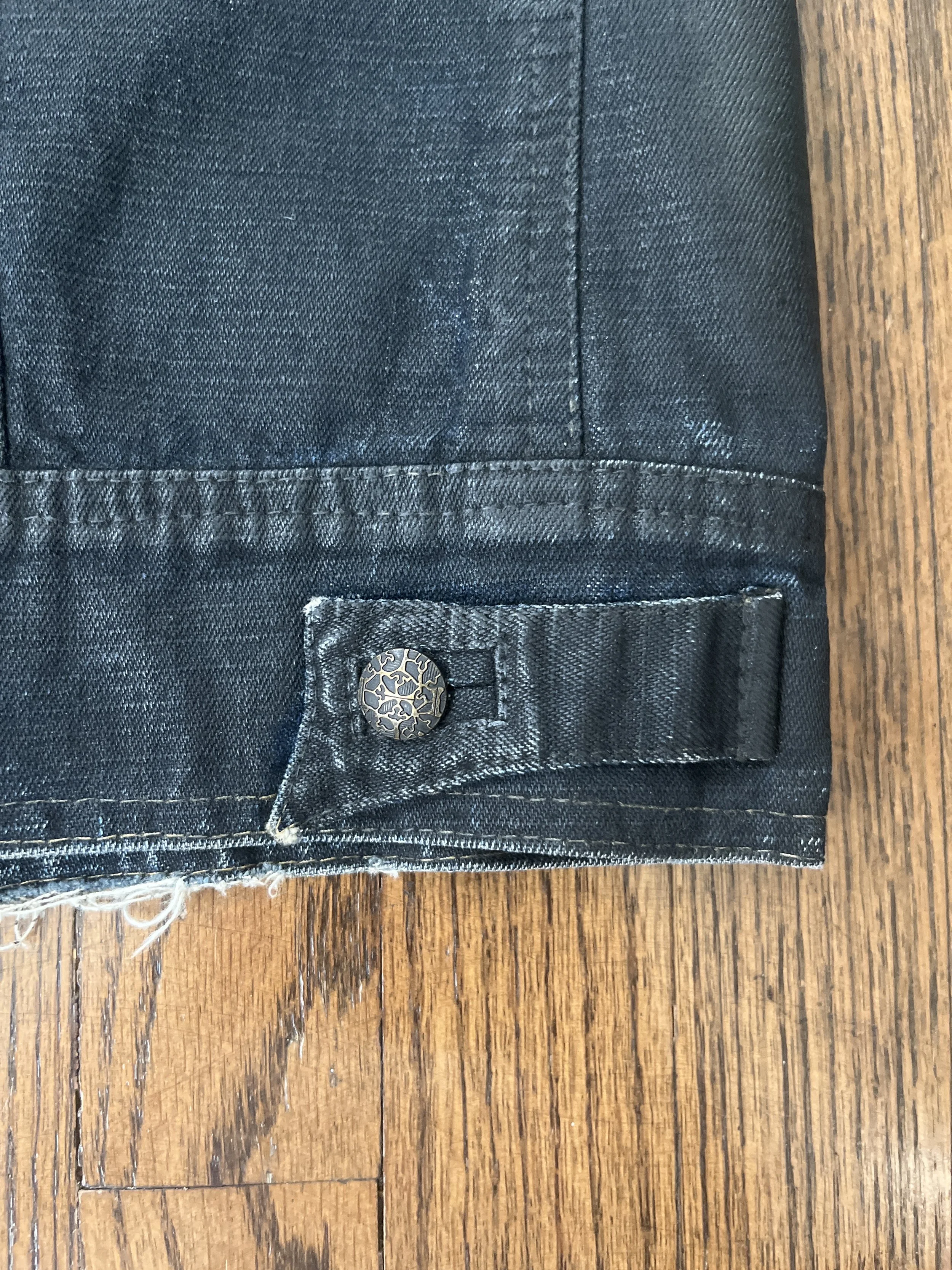 Custom denim jacket detail, side strap with suede backing.