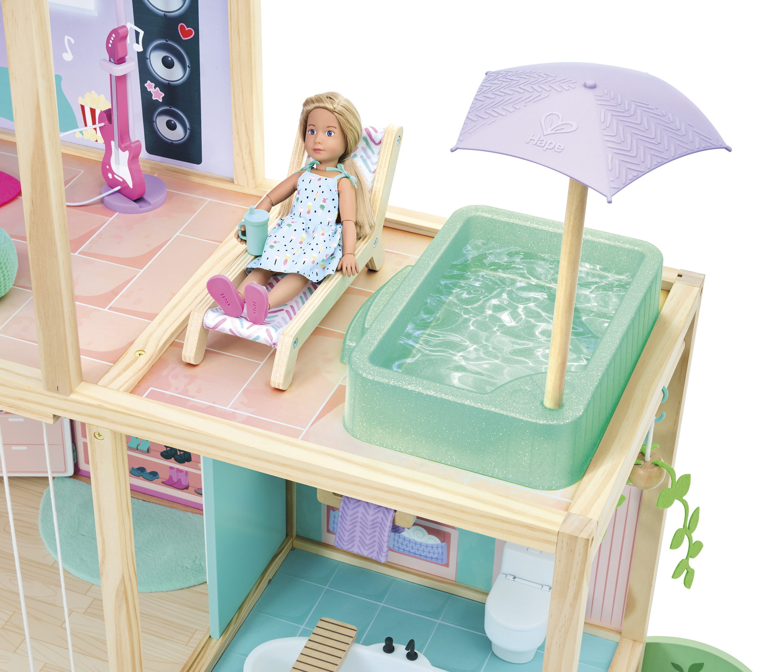 A children's doll on a wooden deck chair holding a green sippy cup, with a purple umbrella nearby, a toy water fountain, a green water basin, and a pink music speaker with a guitar on a stand in the background.