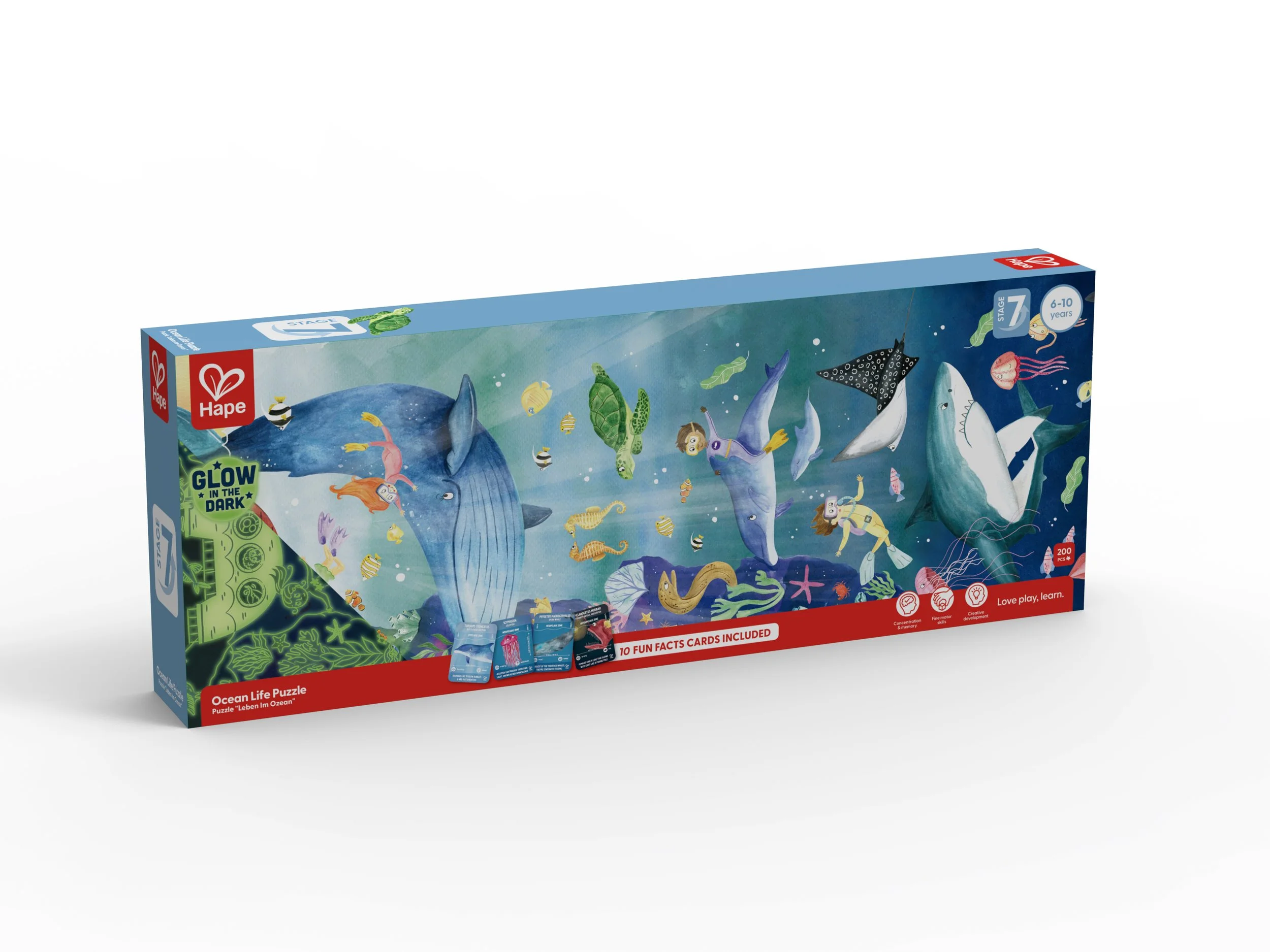 Ocean life Hape puzzle featuring underwater scene with sharks, whales, turtles, divers, and marine animals, some of which glow in the dark.