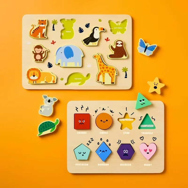 Colorful animal and shape puzzle set on an orange surface with a white base, including puzzle pieces of various animals like a tiger, giraffe, elephant, lion, and butterfly, as well as geometric shapes with fun faces and labels. Developed for Target.