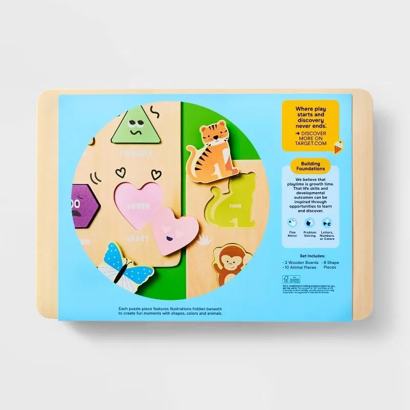 Wooden puzzle set with animal shapes, including a tiger, snake, monkey, and butterfly, with illustrations hidden beneath the pieces. Developed for Target.