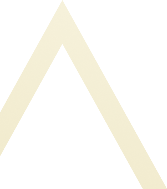 Close-up of a black background with a large, cream-colored letter 'A'