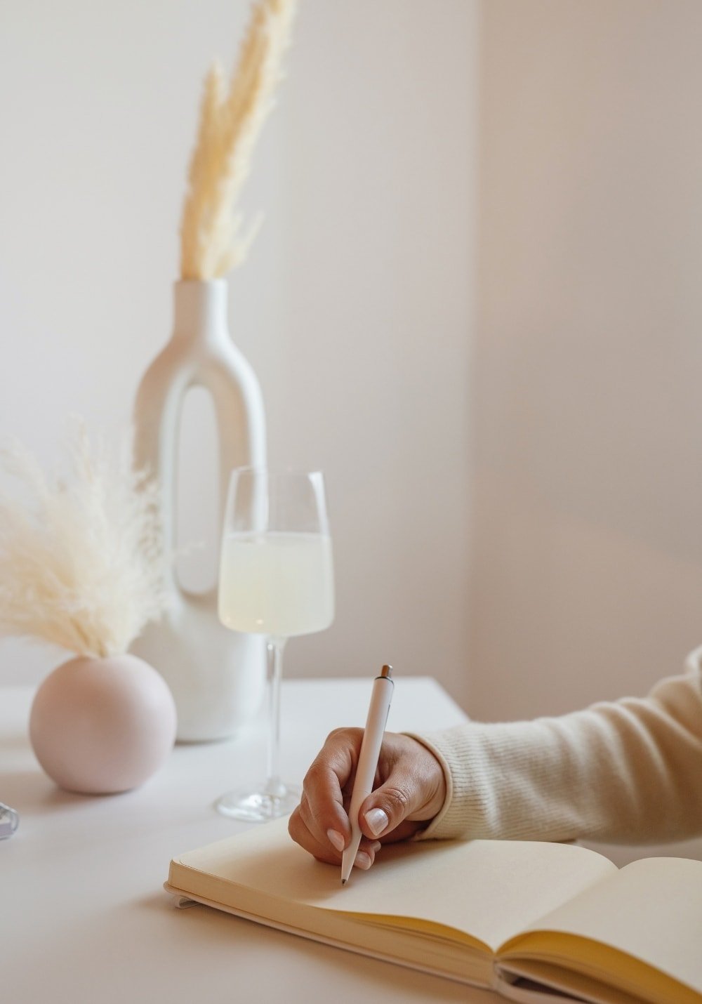 A woman writing and shaping a brand strategy