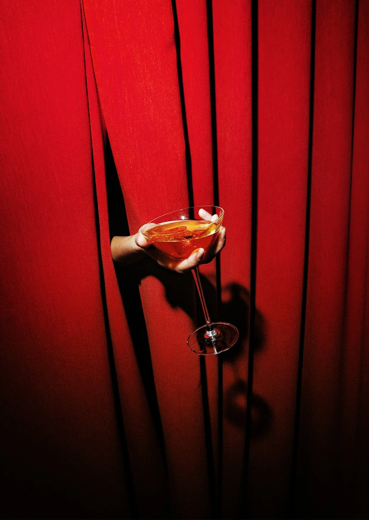 Drink between curtains at party in Spain.jpg