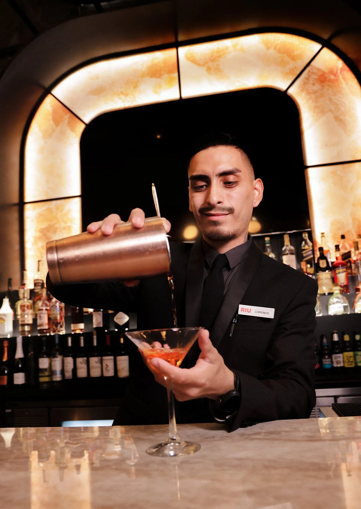Waiter serving elegant cocktail in a hotel in Mallorca.jpg