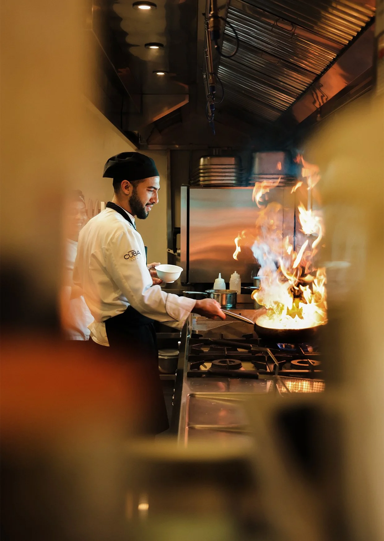 waiter serving more champage to customer who is.jpg