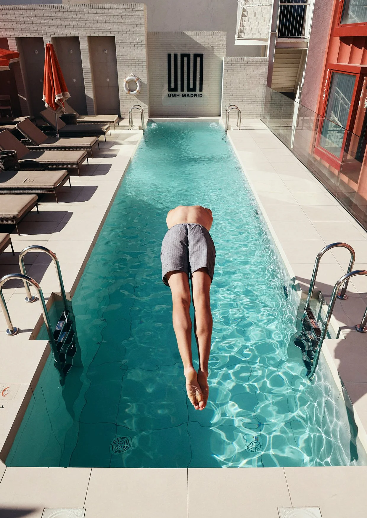 Jumping into the hotel pool -.jpg