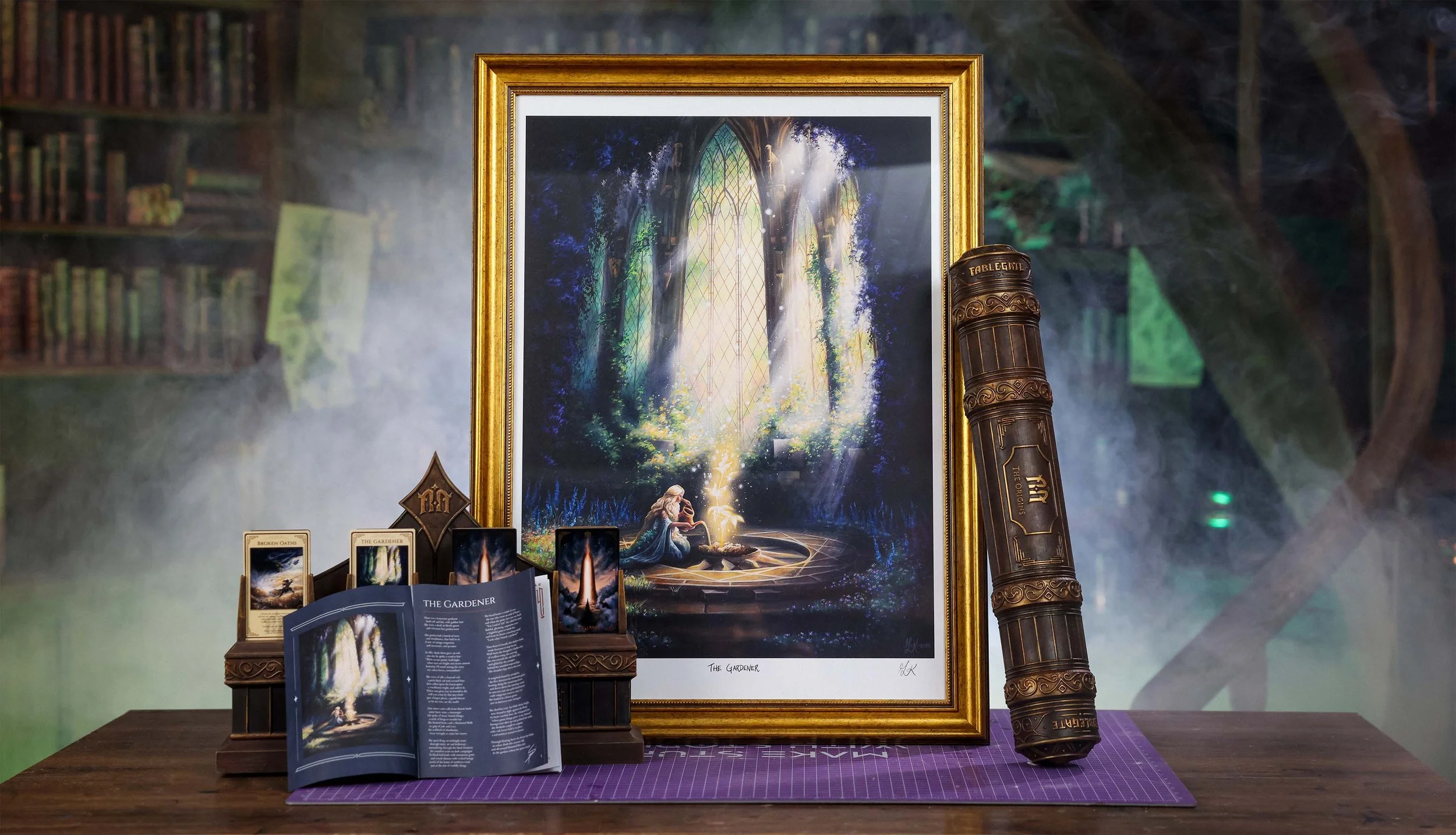 A framed fantasy artwork titled "The Gardener" depicts a woman watering a magical flower while basking in light through large windows. Surrounding it are the printable models and booklet.