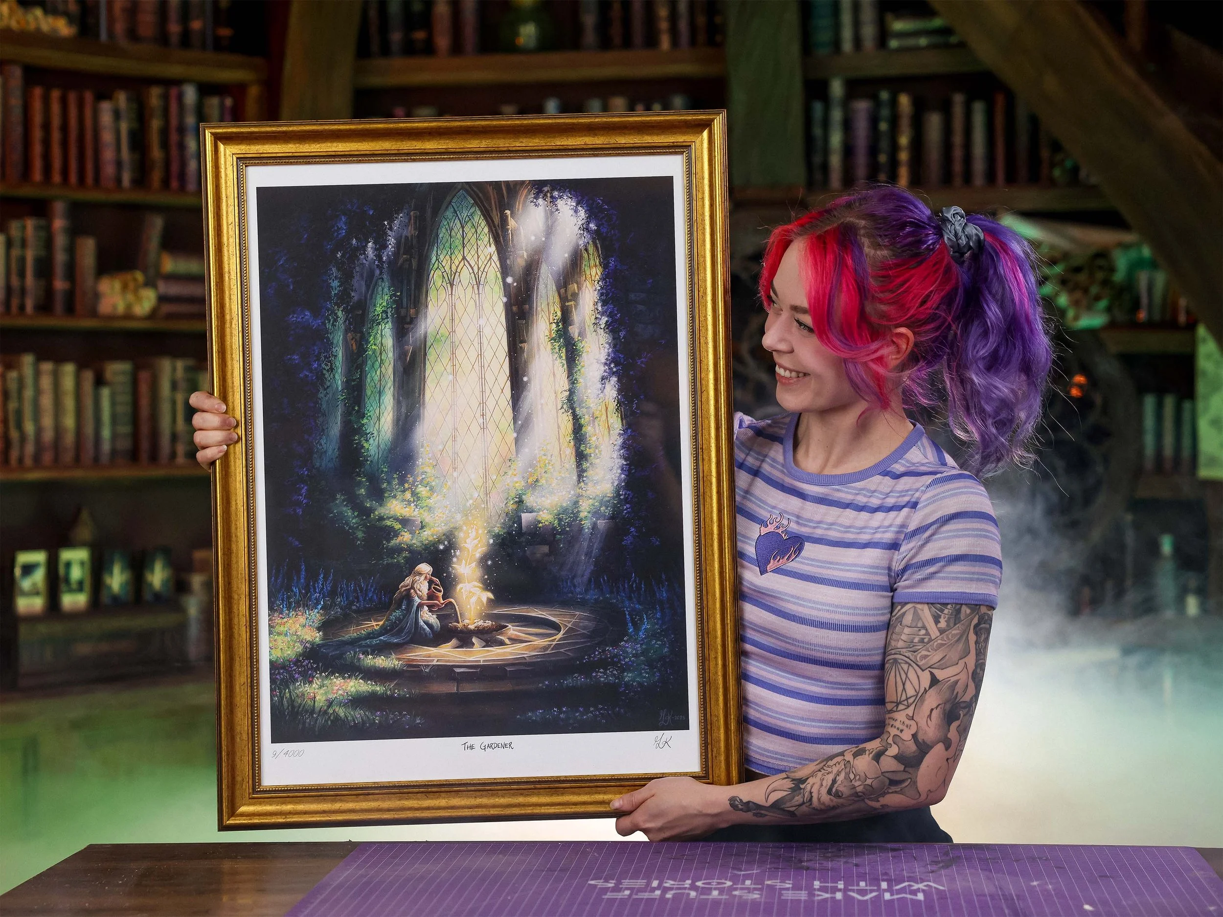 Martina from Nerdforge holding "The Gardener" signed and limited print.