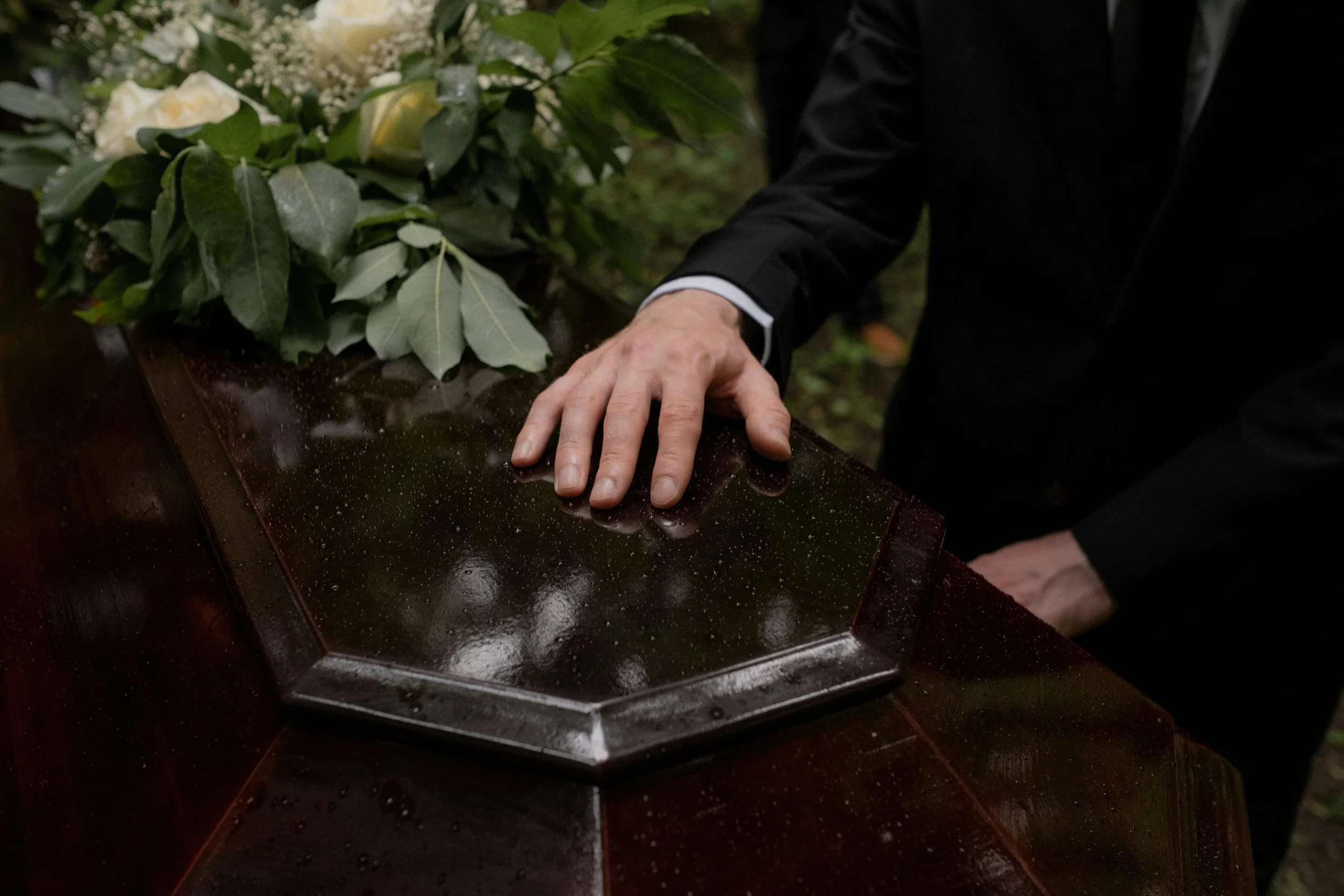 hand-on-coffin