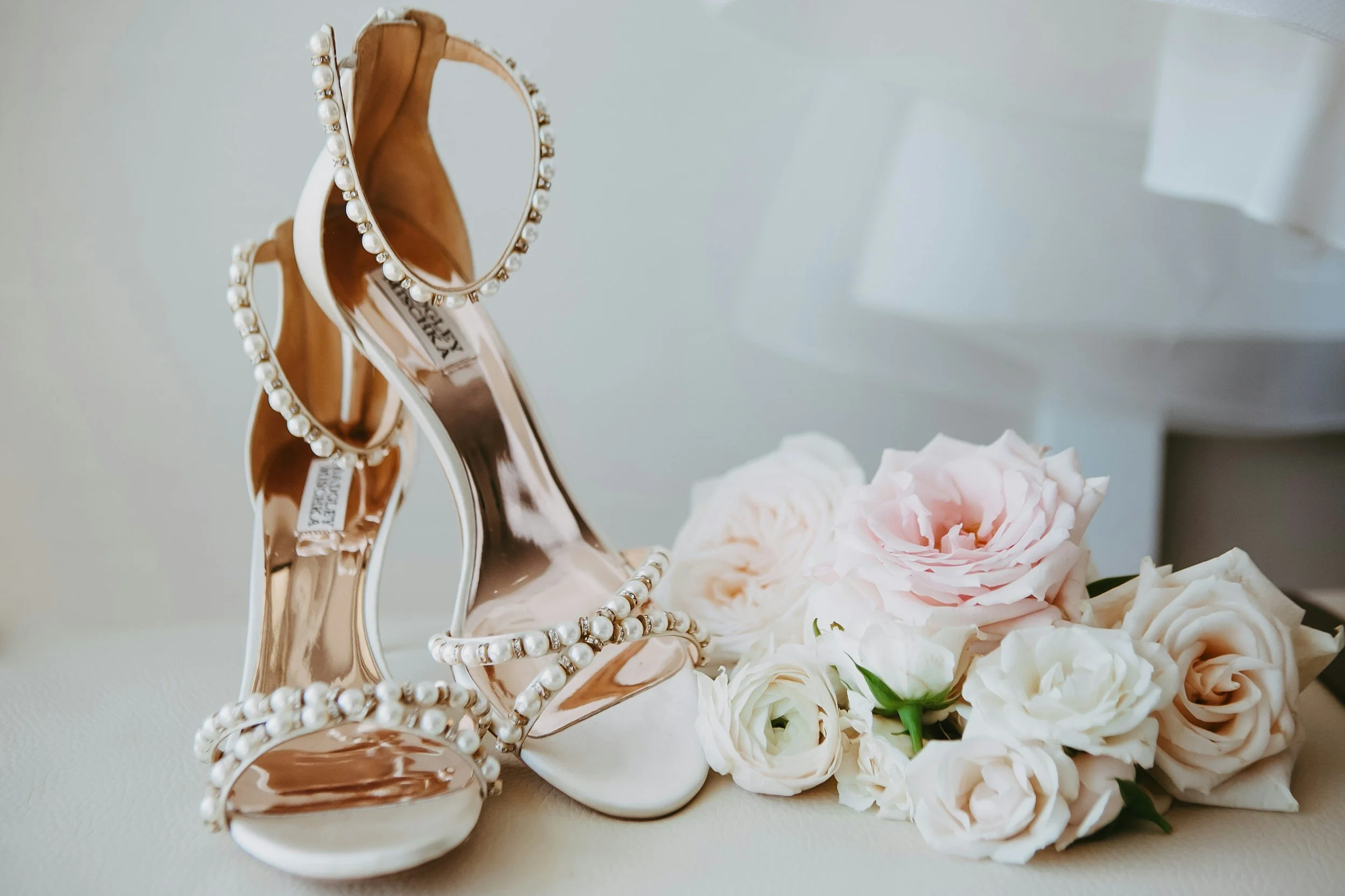 brides shoes and flowers together