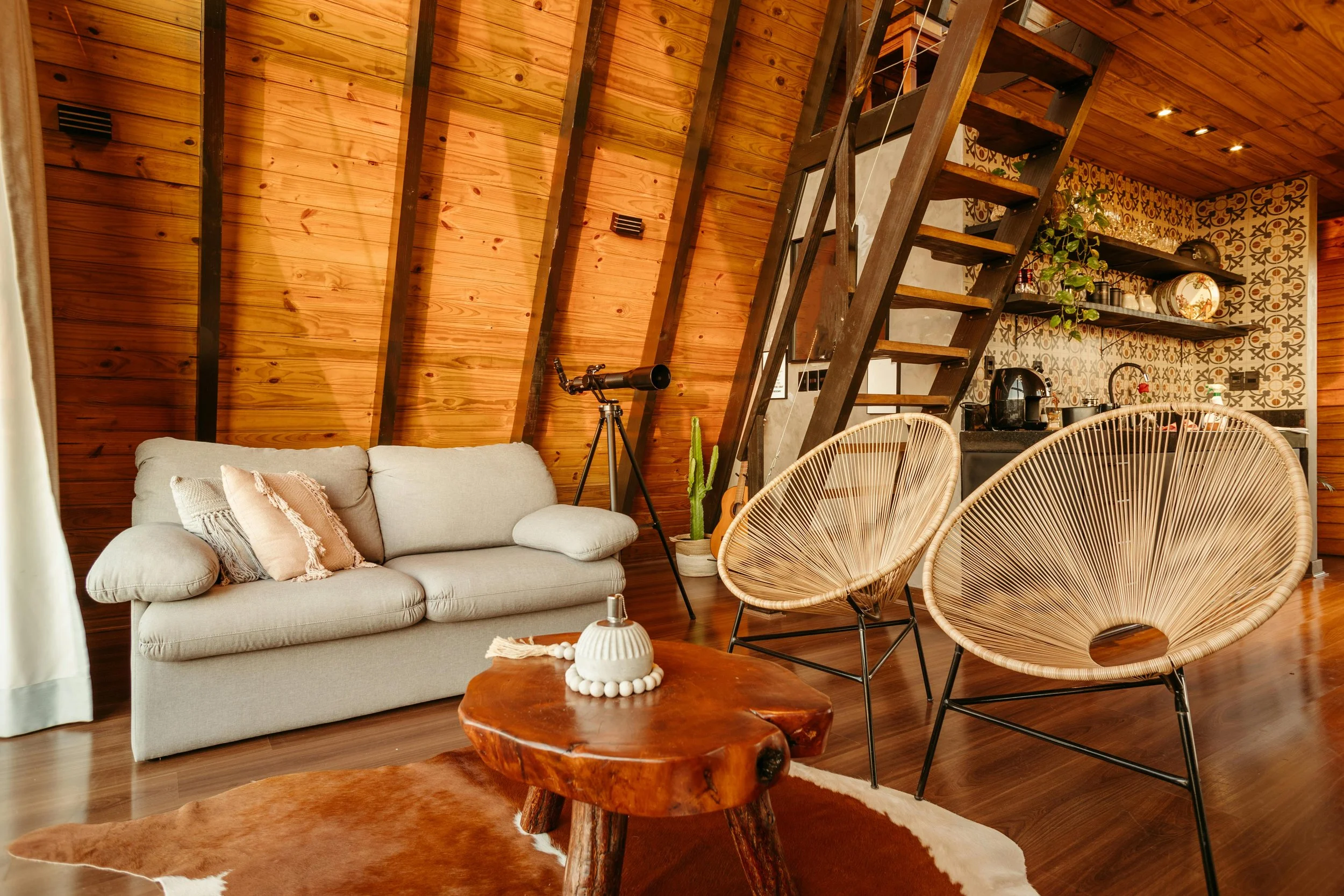 rustic holiday cabin with wooden details and soft furnishings