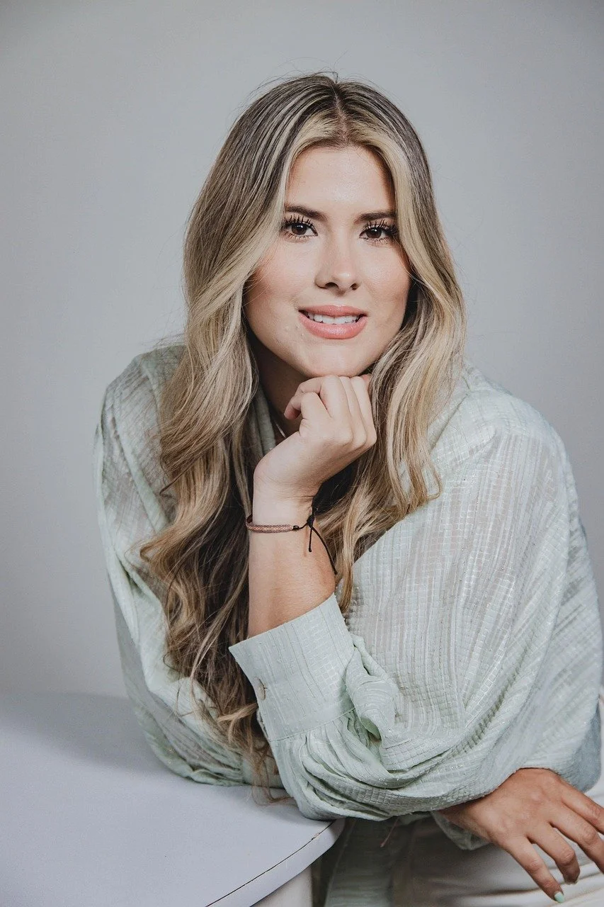 business woman leaning against a table rest head on hand