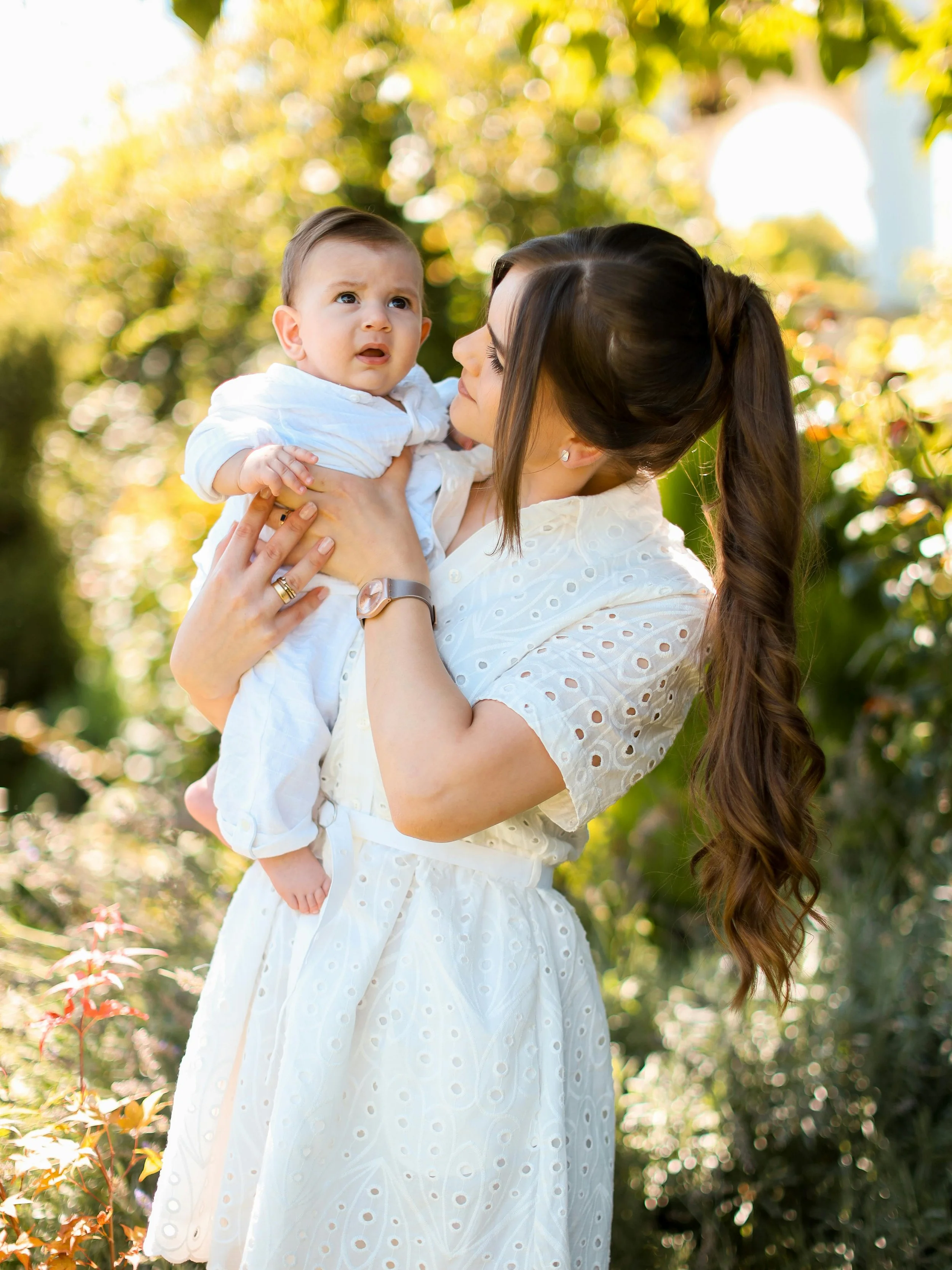 mother holding her child looking at them