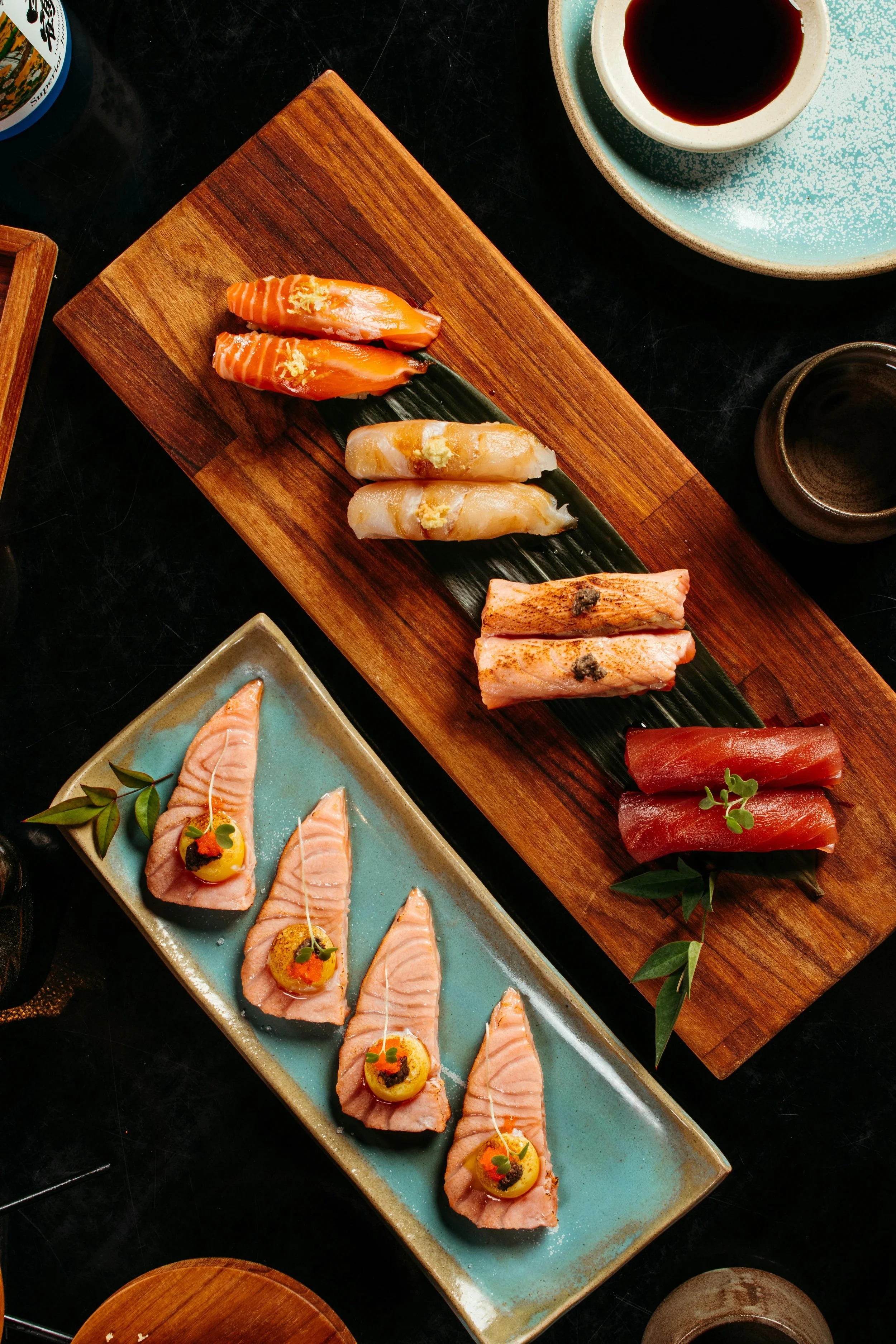 restaurant food served on a wooden chopping board and green plates