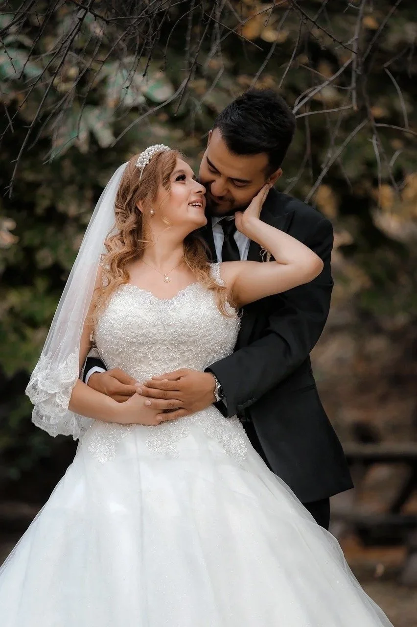 bride and groom looking at each other and bride holding grooms face