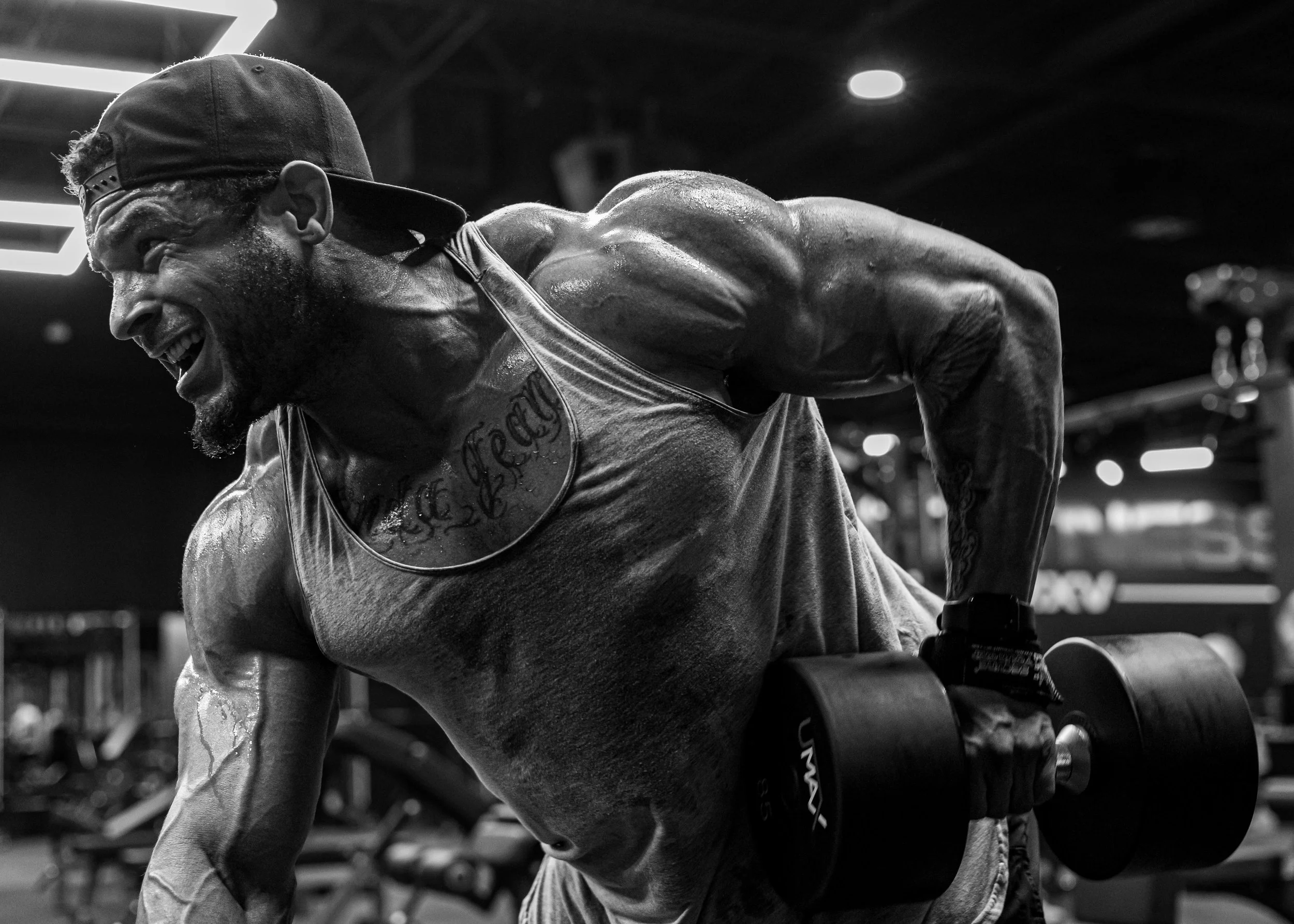 black and white image of arm workout with dumbbells