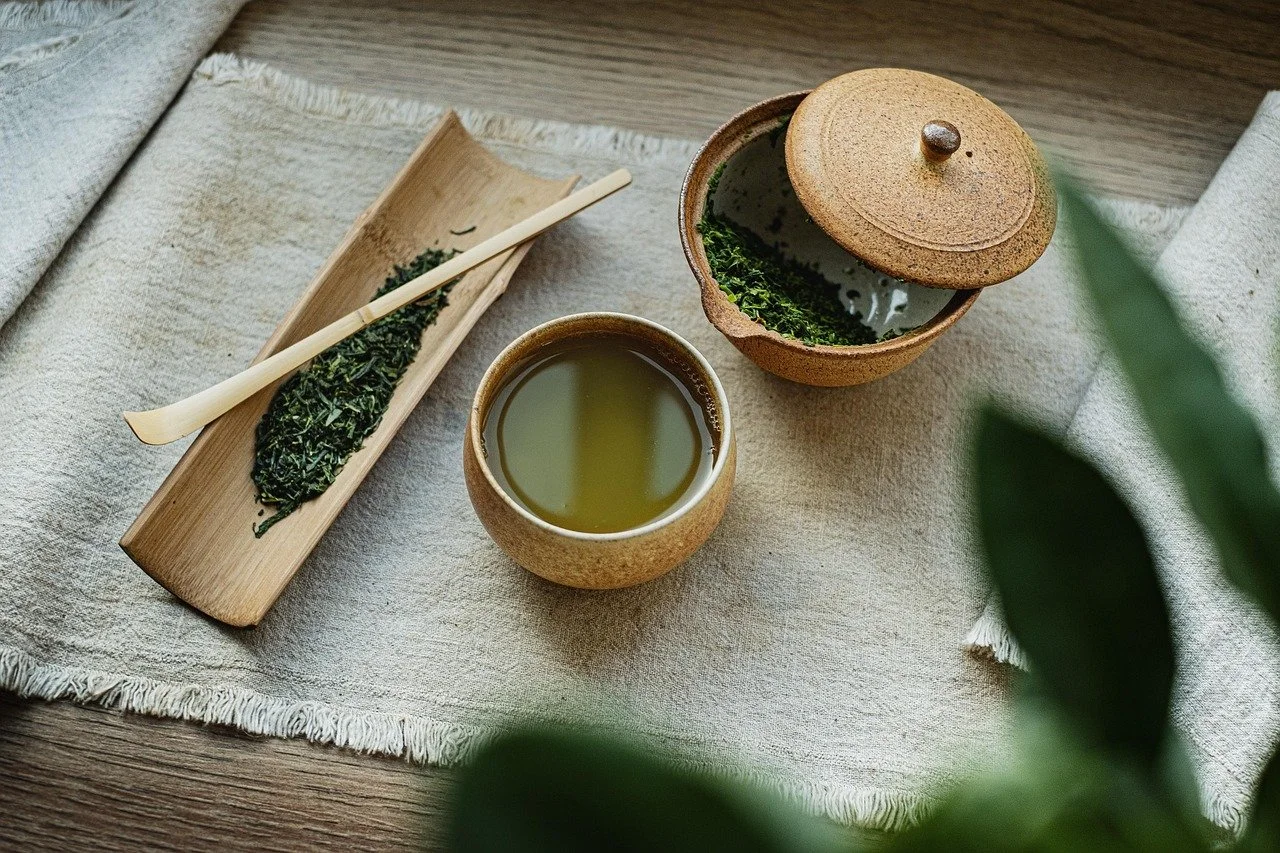 organic greens and green tea on natural background