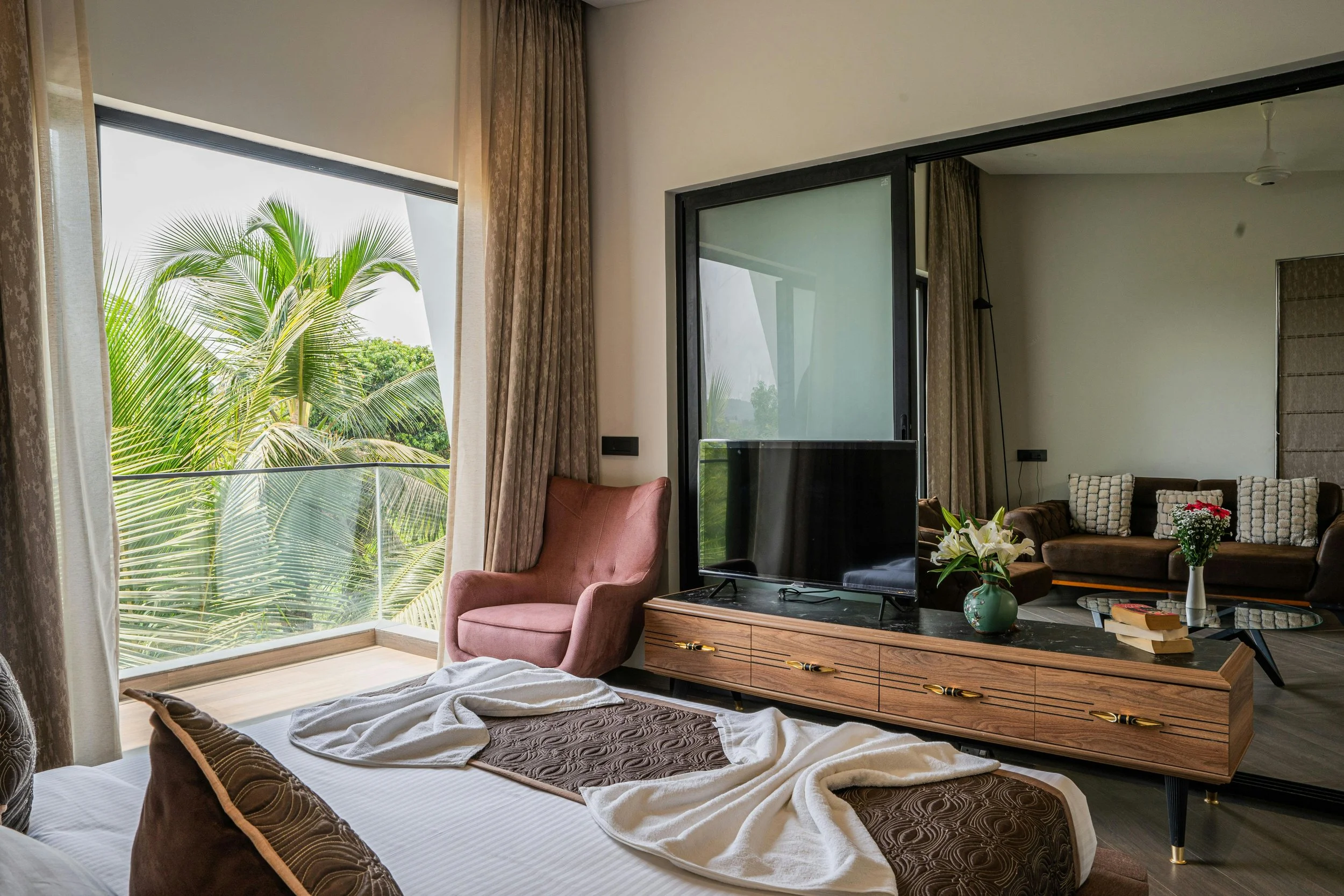 70's style bedroom with large open window and wooden details