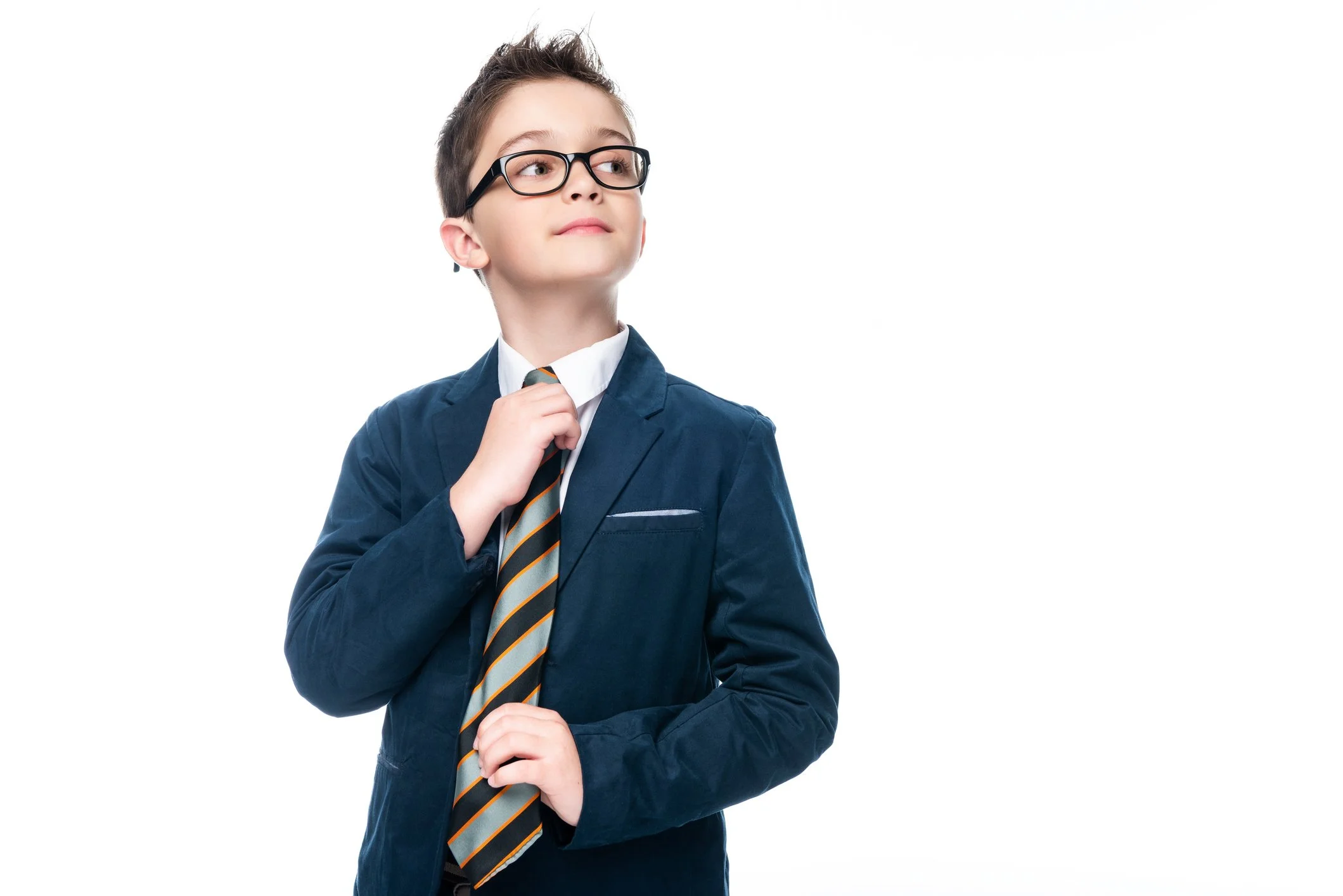 Child in a suit holding a coffee cup and peering over his glasses