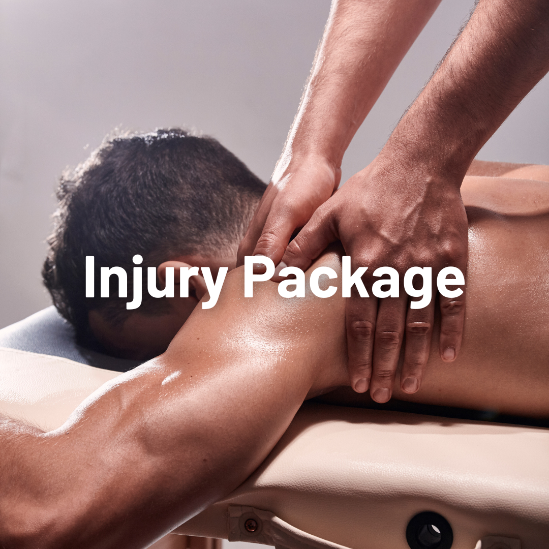 A person receiving a massage while lying face down on a massage table, with the massage therapist's hands on their shoulder and upper back.