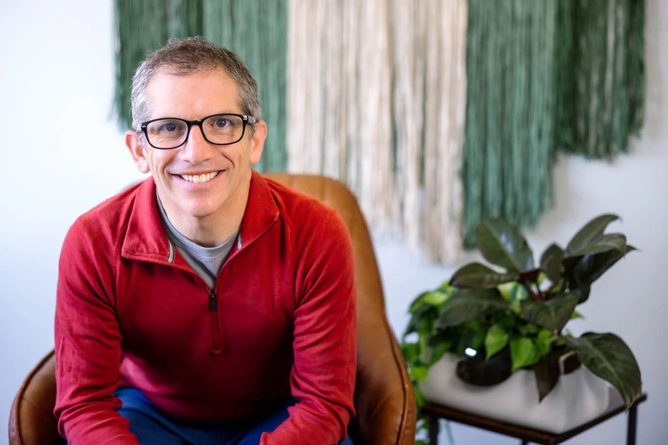 David Lieberman, LMFT, smiling in his office