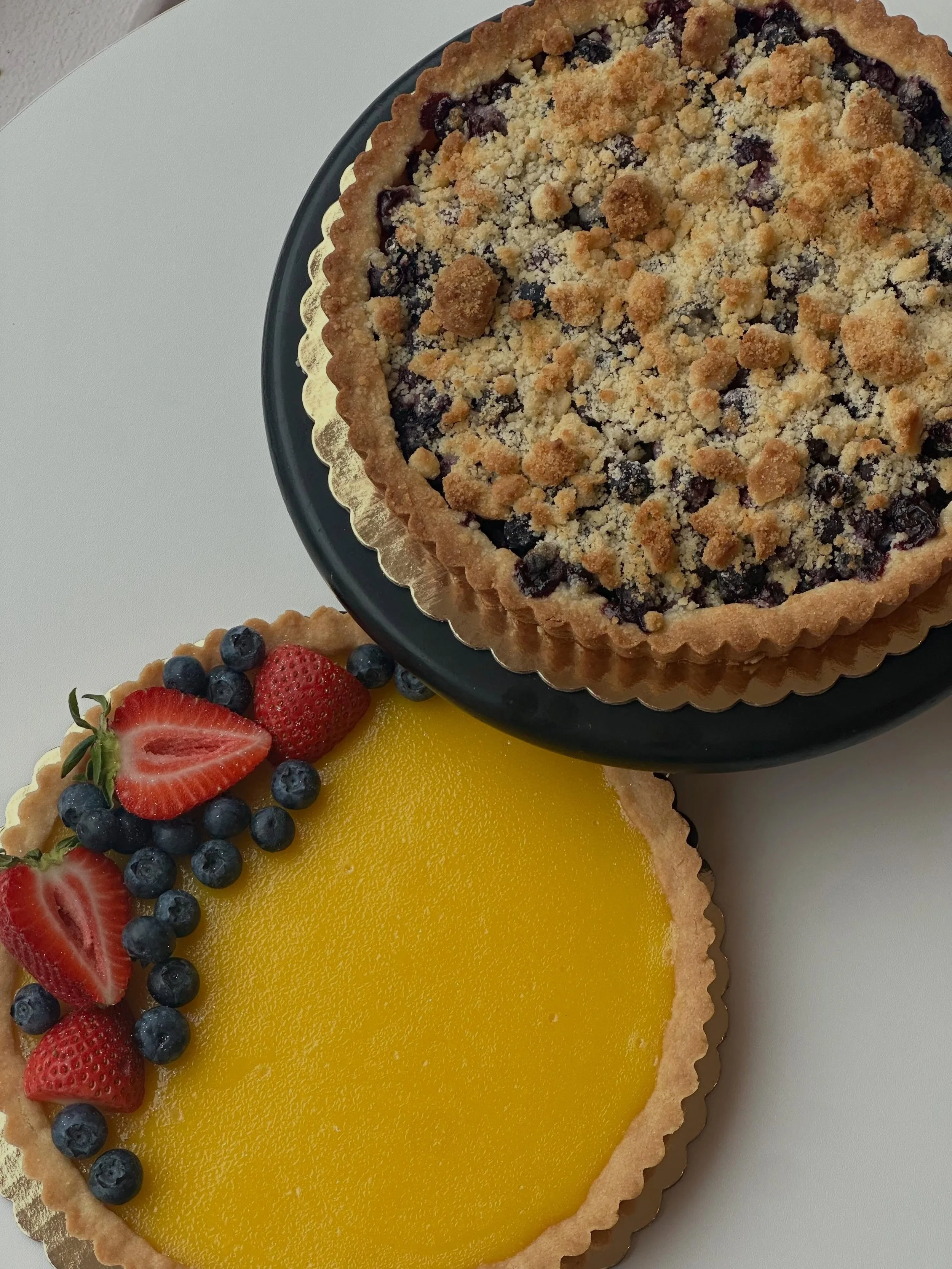 It&rsquo;s Mother&rsquo;s Day this Sunday! 💐 We&rsquo;re making some special tarts for her- Blueberry Crumb 🫐 &amp; Lemony Lemon 🍋, email or call the shop to preorder or walk in all weekend. Will have plenty of cakes &amp; treats, come by- We Love